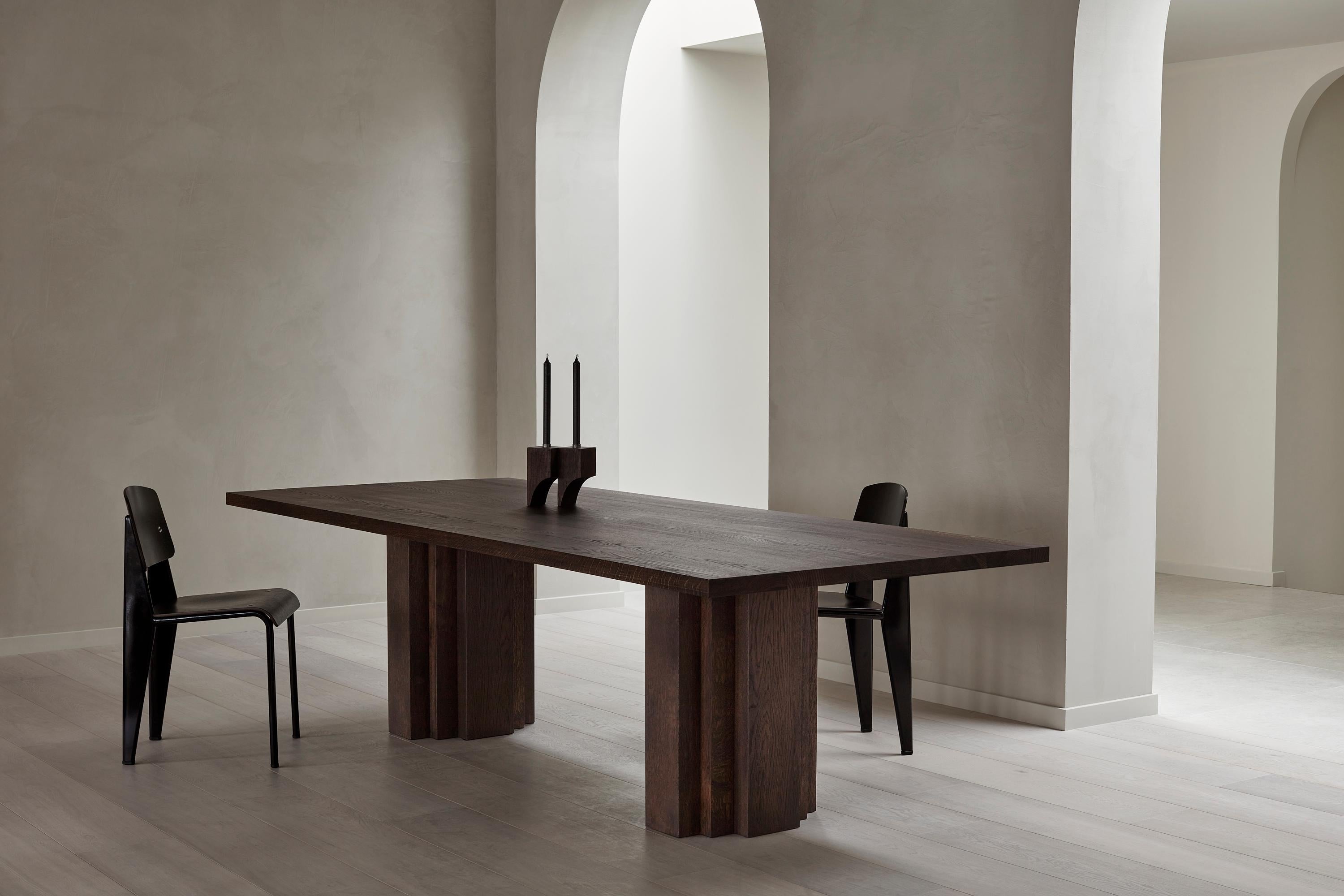 The Brut Table takes cues from Brutalism and Amsterdam School architecture. Voluminous columns with a monumental aesthetic support the heavy table top. The table is designed by Aad Bos and crafted in the Netherlands.

Mokko is an Amsterdam based