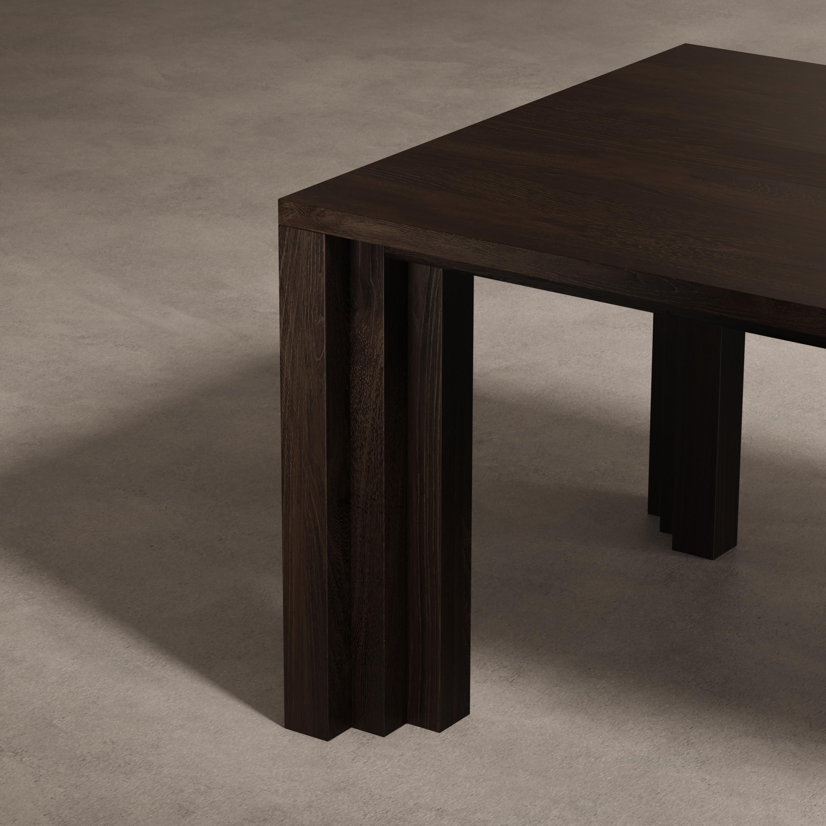 The Cadence Table, features a flow of volumes and shade lines in a sequence that is rhythmic and exciting. Its repetitive forms deepen the meaning of the home's altar that is the table. The table is made from solid hardwood and designed by Aad