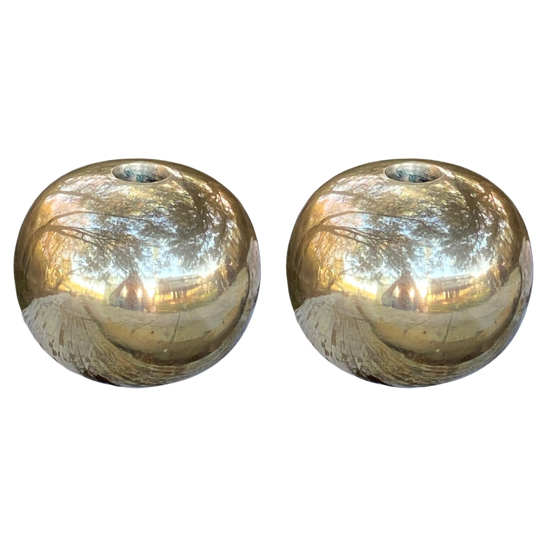 These gorgeous spherical brass candle holders exude timeless elegance and understated sophistication. With their minimalist form and serene design, they embody a sense of quiet refinement that adds a touch of class to any space. The smooth, rounded