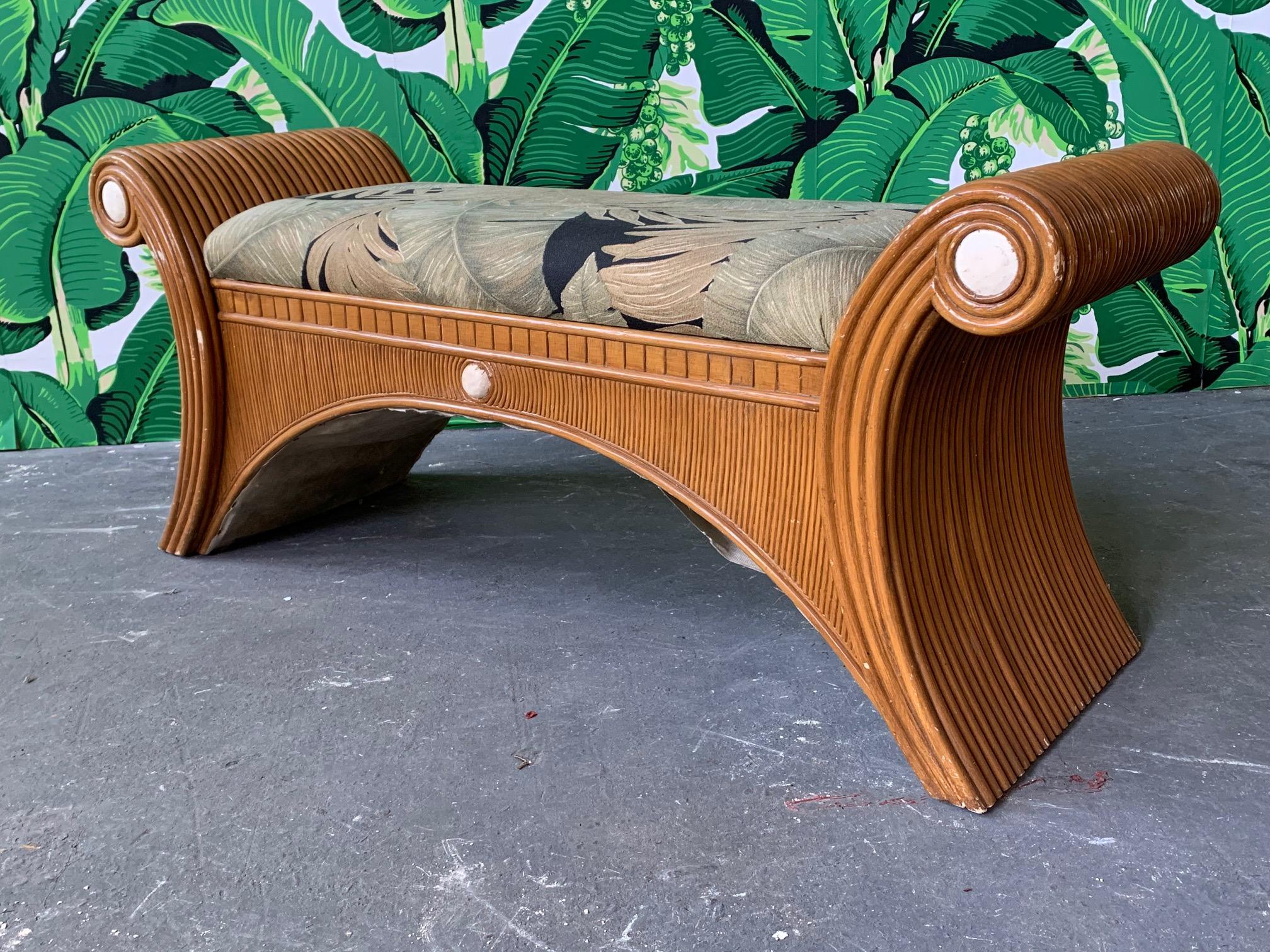 Vintage bamboo bench features split reed veneer and palm leaf upholstery. Good vintage condition with abrasions to finish. Structurally sound.
  