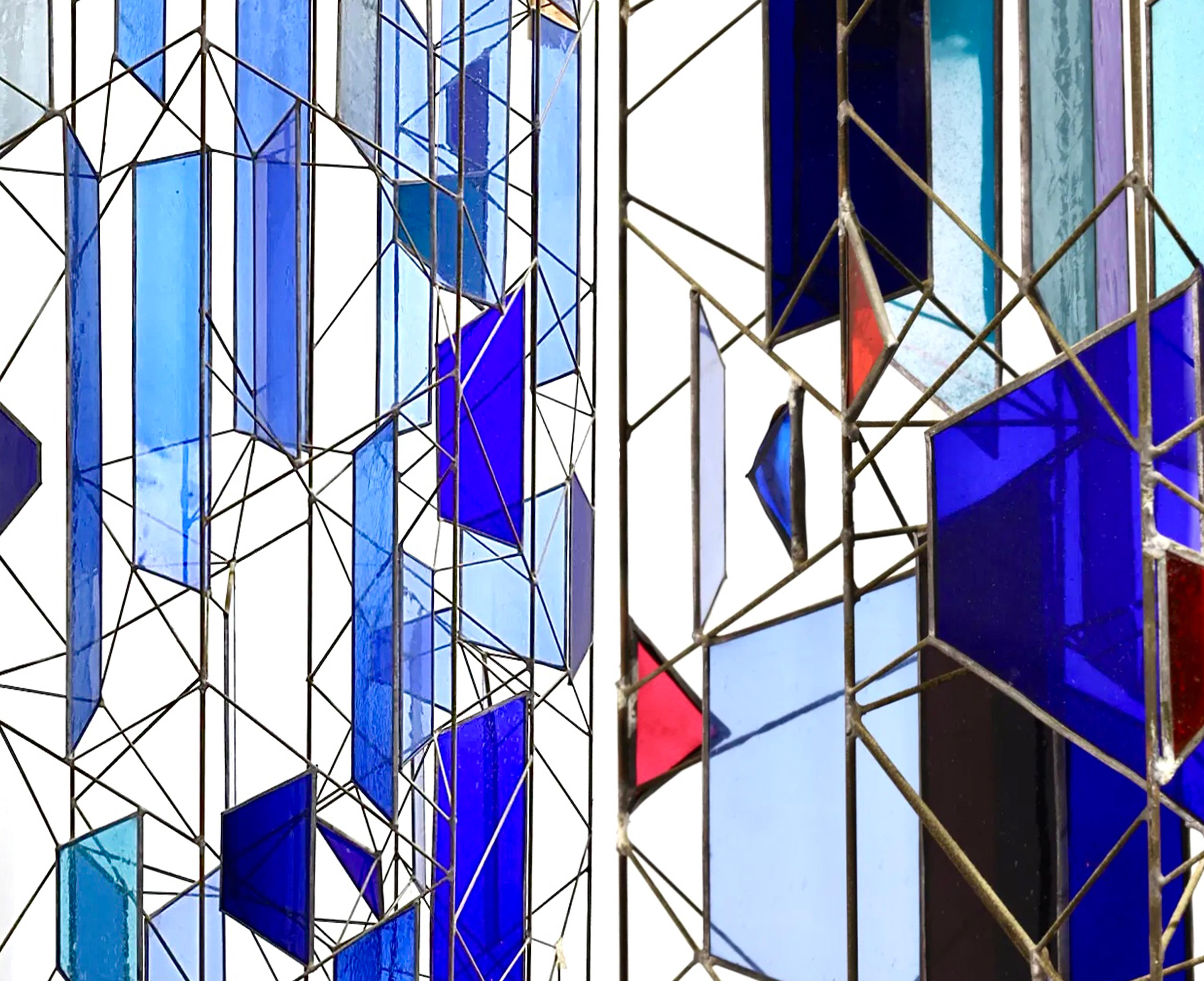 Sculptural Stained Glass Tri-Partite Screen, Room Divider, Blue, Joseph Ferguson USA

There is no surface for stained glass color to flow onto. Like a picture puzzle, it must be constructed, each piece of colored glass cut to shape and fixed into a