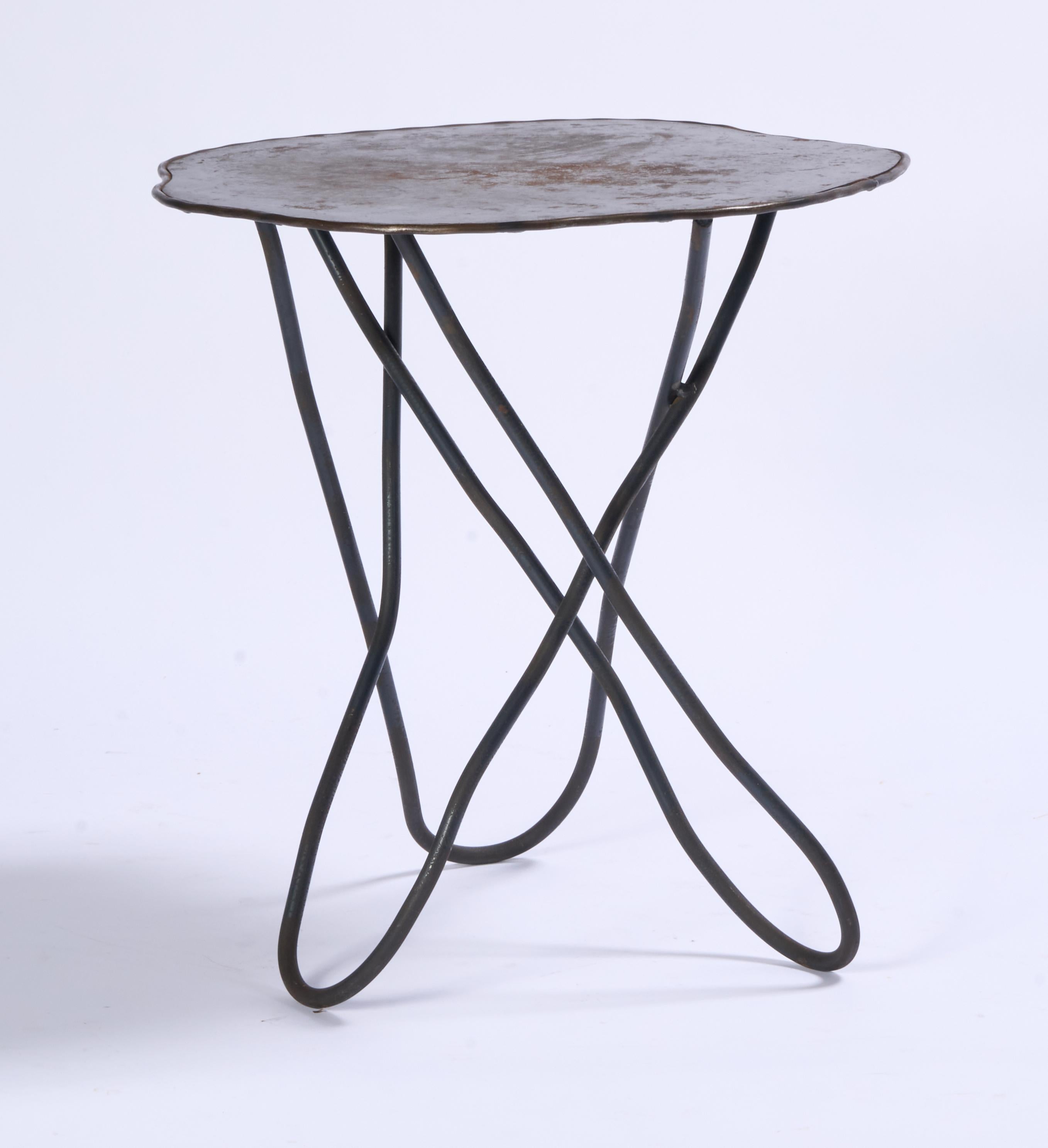 Welded steel studio made side table. Patina to the top as shown.

20.25 x 19.75 x 20.75
