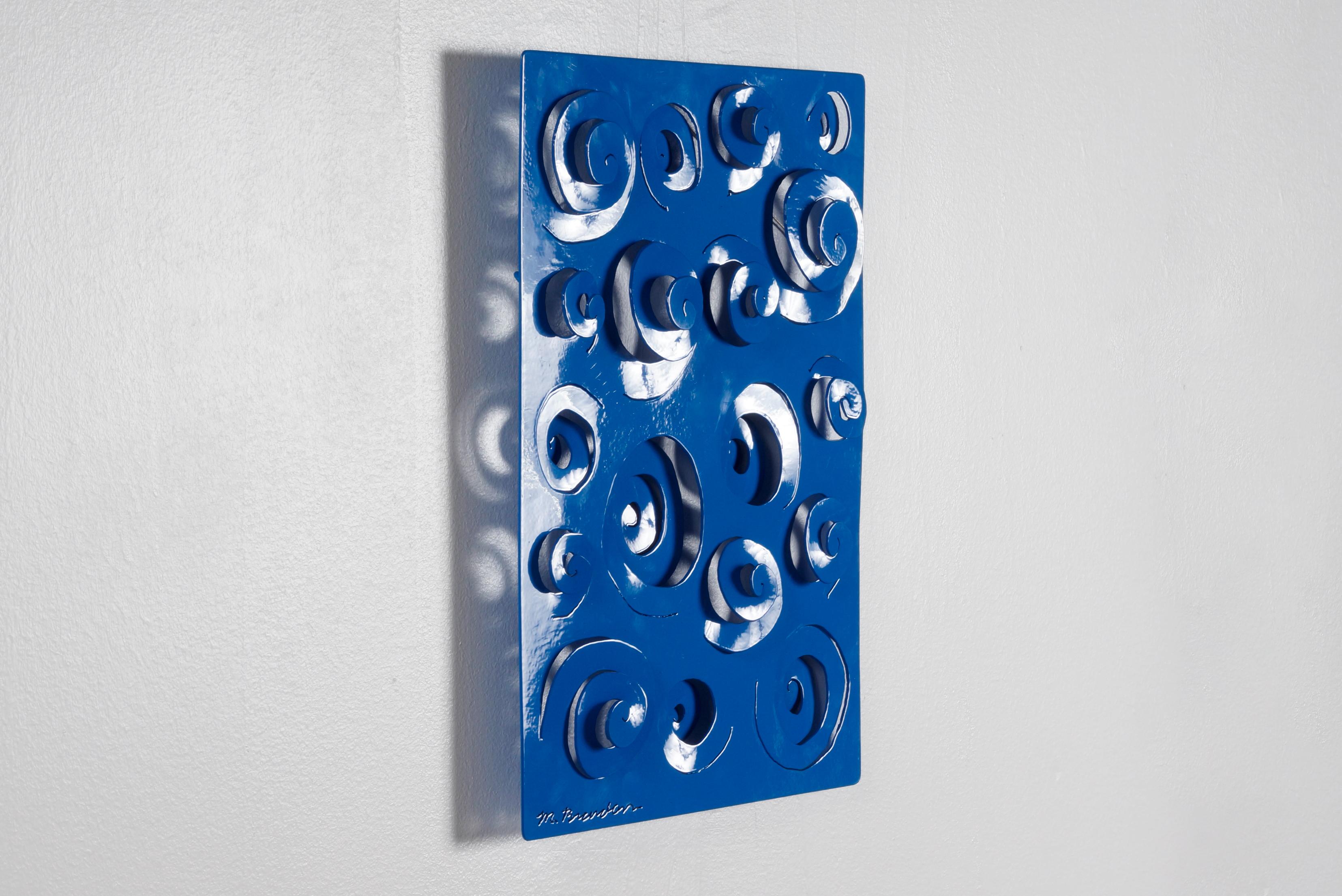 Found laser cut sheet metal wall hanging with optical swirl design. We reclaimed this piece with a new gloss blue powder coated finish. Signed M. Brandon, circa 1990s. One of a kind. 

Dimensions: 14