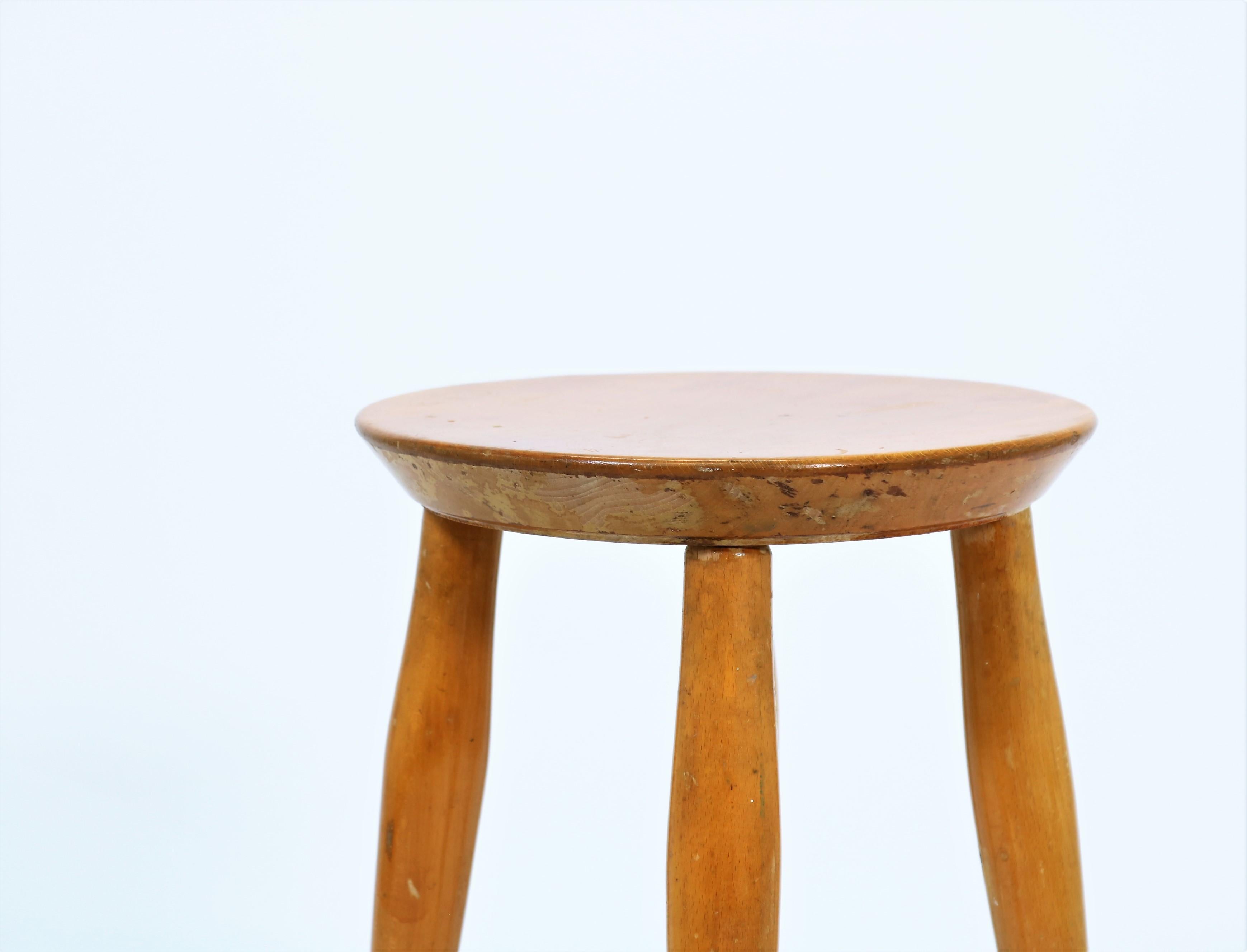 Unique and beautifully worn stool by an unknown Danish cabinetmaker. Probably made in the 1930s-1940s in the early days of the Danish Modern movement. The stool is skillfully crafted in lacquered beech with lots of brilliant details. The style is