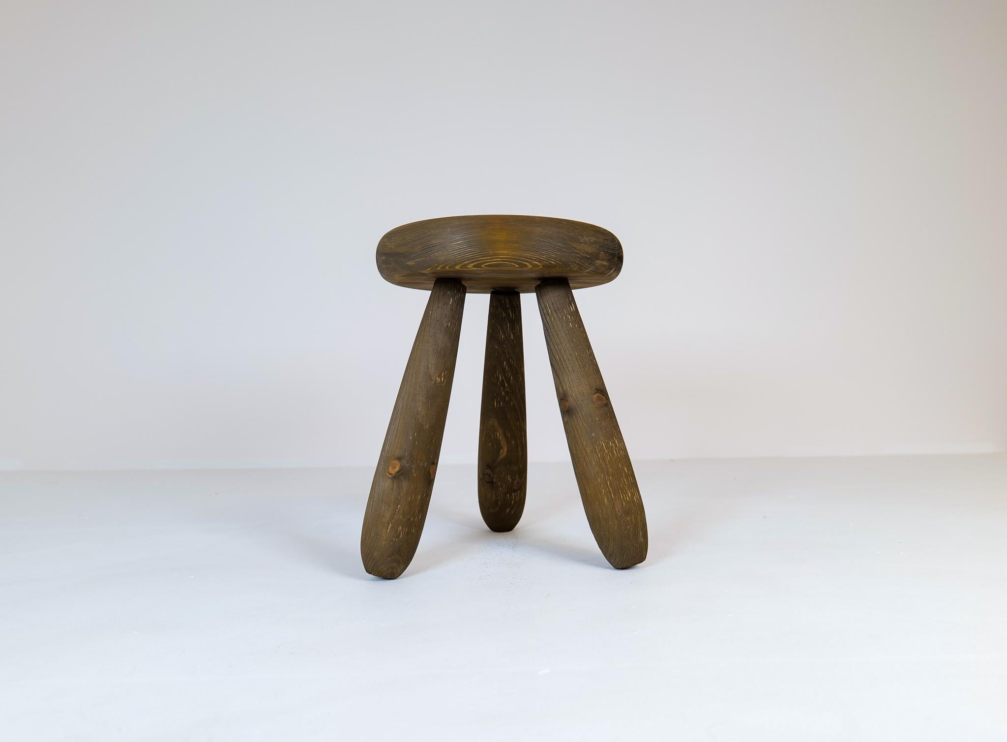 A stool in stained solid pine with rare complexity in the different colors of the wood.
This stool is a good example of the good craftsmanship and minimalistic stile to come in Scandinavian furniture. 

 Very good original condition with a