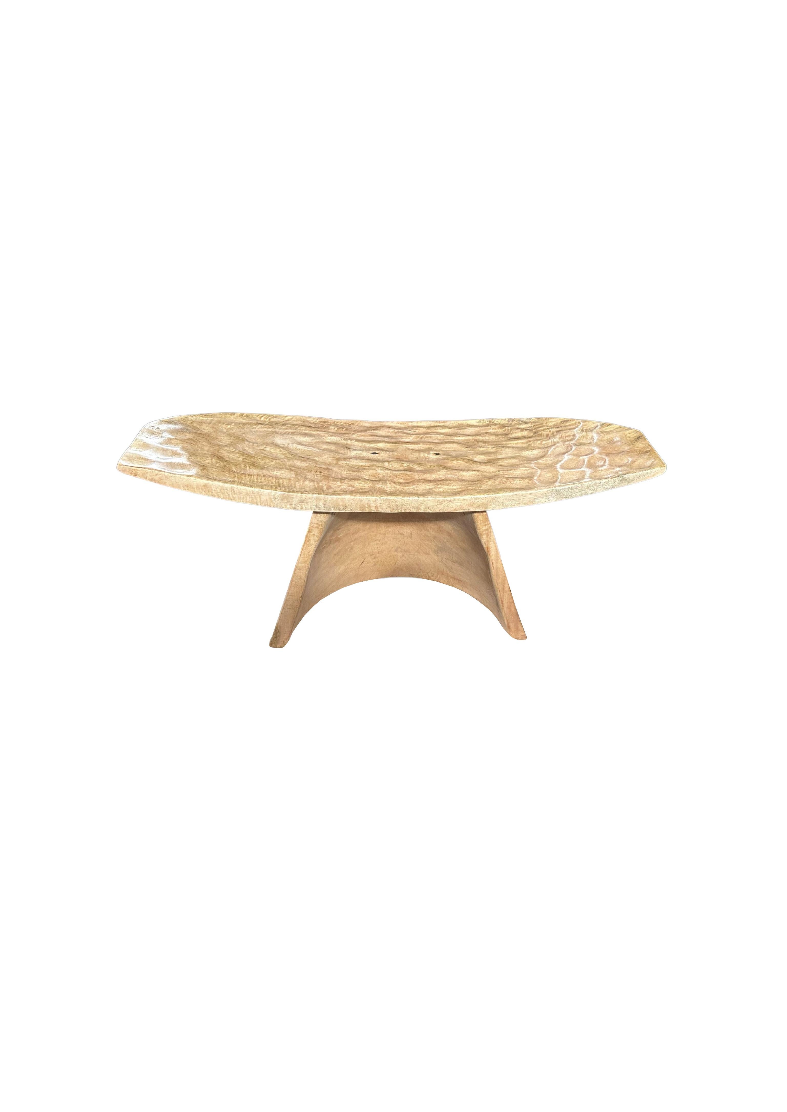 Indonesian Sculptural Stool with Curved Seat & Hand Hewn Detailing, Natural Finish For Sale