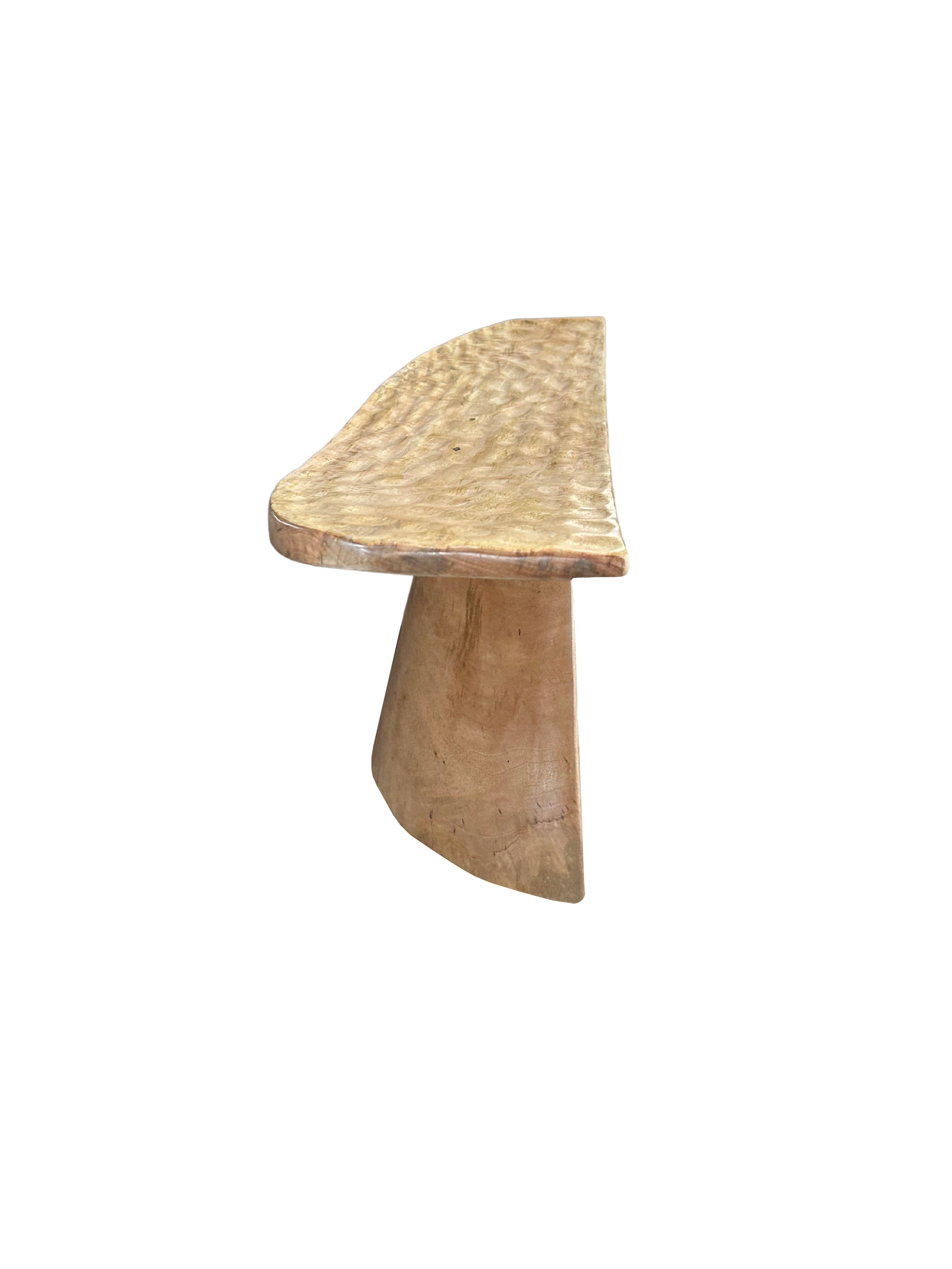Hand-Crafted Sculptural Stool with Curved Seat & Hand Hewn Detailing, Natural Finish For Sale
