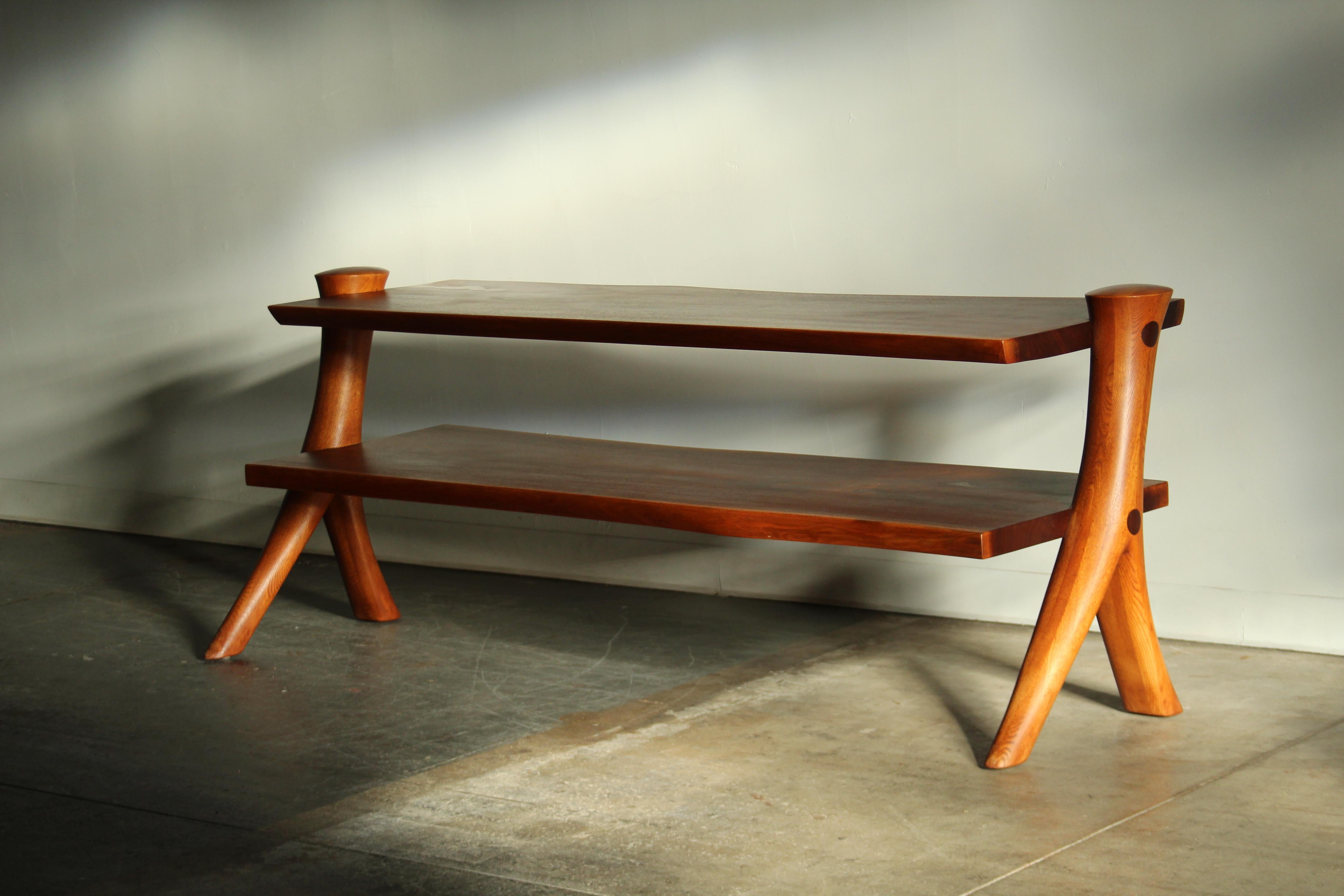 A one-of-a-kind studio crafted, large room divider or console by woodworker and Professor Emeritus at Maine College of Art, Gary Ambrose. This piece was crafted in 1984 and is constructed of solid Claro walnut. It features highly sculpted legs, live