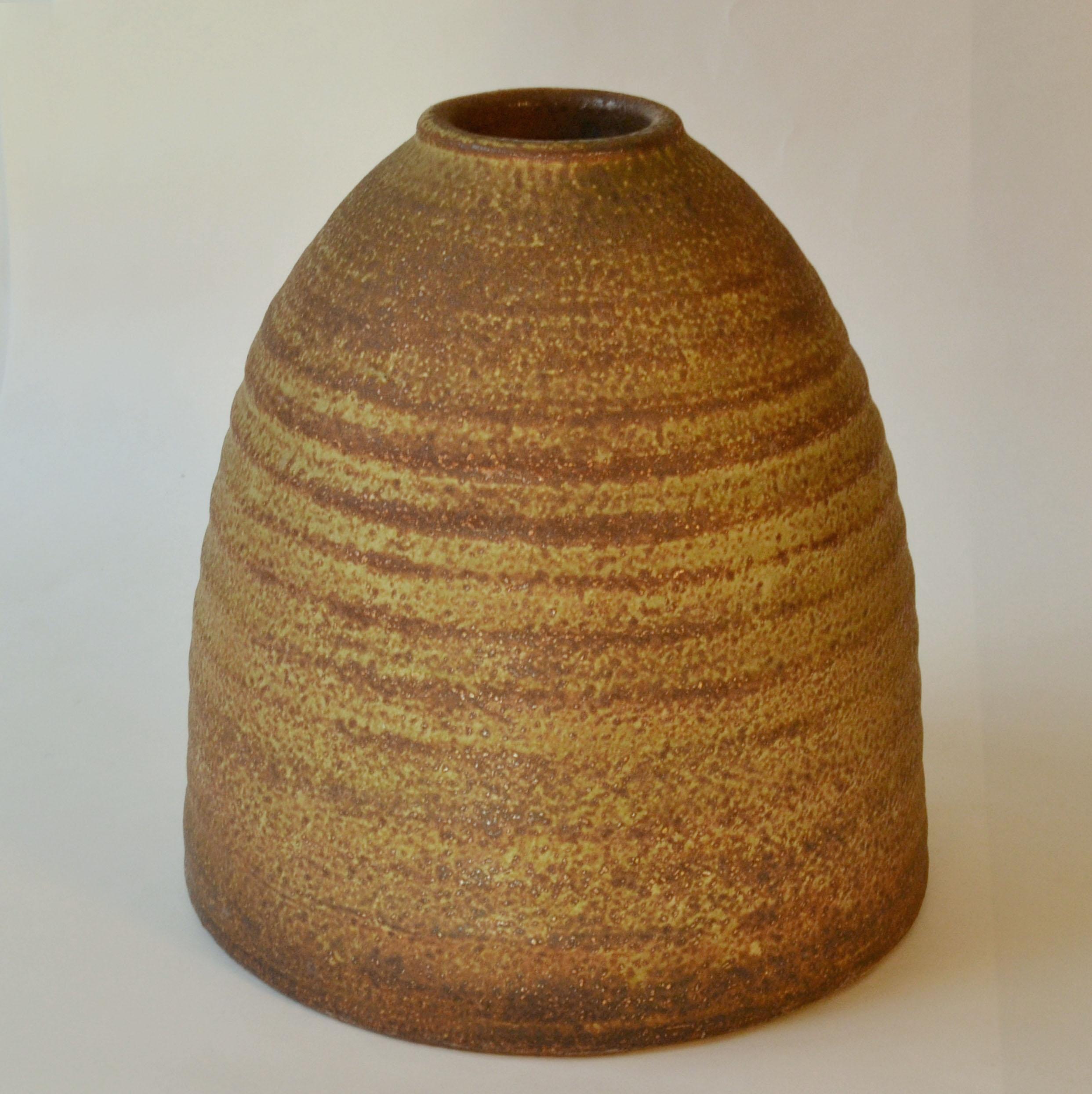 Sculptural beehive shape studio pottery vase created on the turning wheel by highly technical skilled Dutch ceramist Piet Knepper for Mobach Studio in the 1960s. The glaze in tones of ochre, oxidized green and browns is created by natural resources