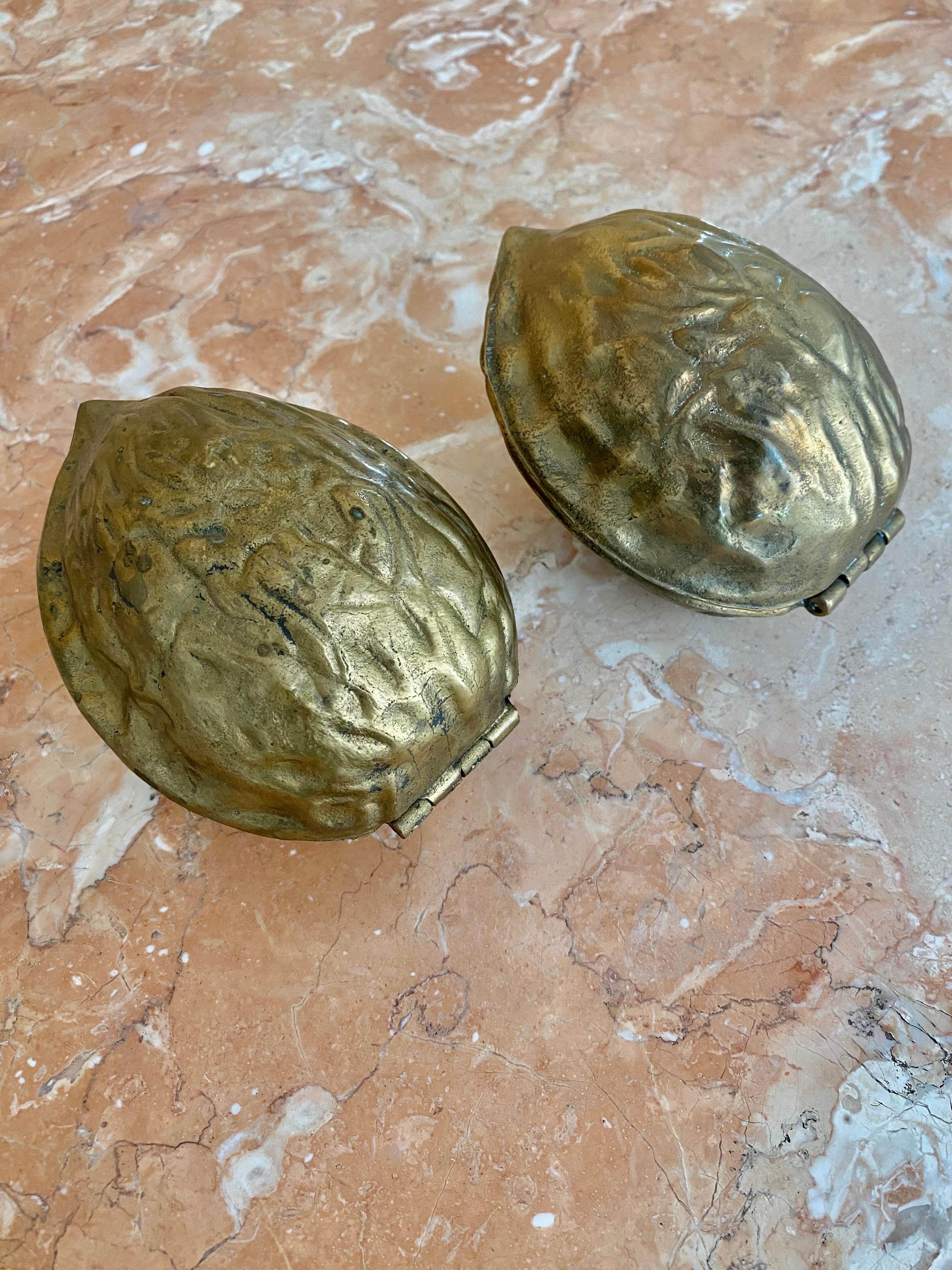 Mid-Century Modern Sculptural Surrealist Cast Brass Walnut Nutcracker Paperweights, A Pair For Sale