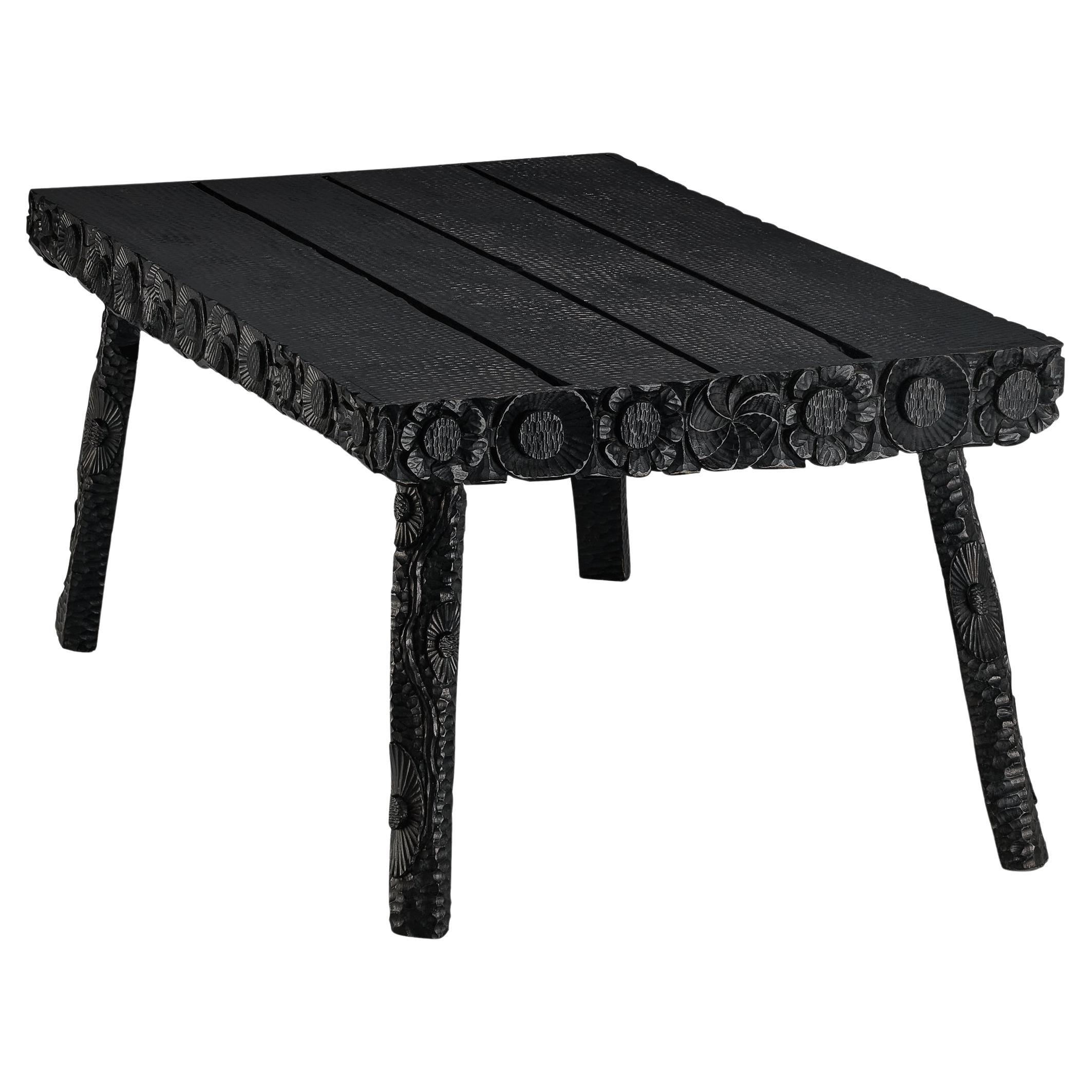 Sculptural Table in Black Lacquered Wood with Decorative Carvings  For Sale