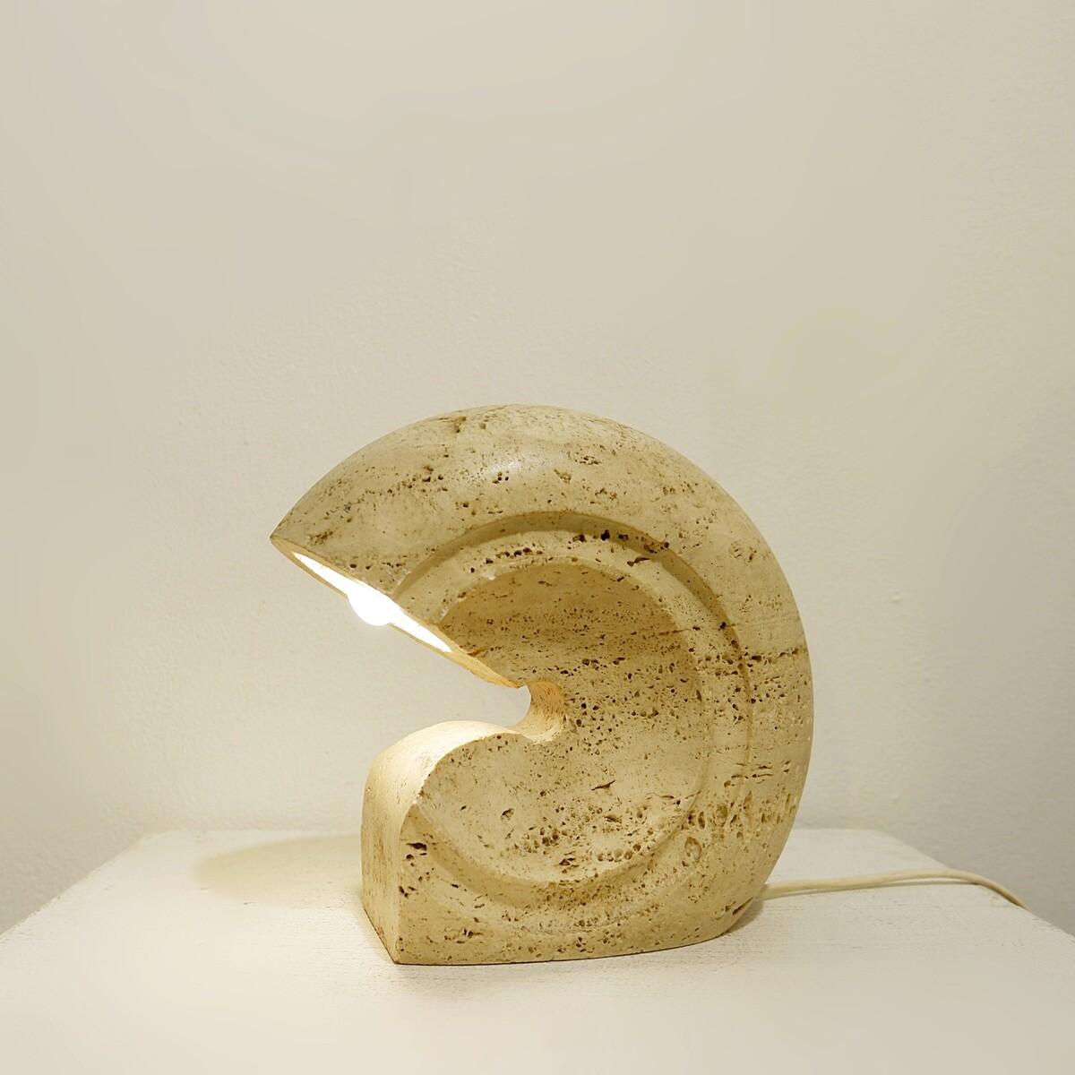 Beautiful organic travertine table lamp, designed by designer Giuliano Cesari, manufactured by Nucleo Sormani, Italy, circa 1970. A special vintage piece with a beautiful round shape that is cut from one piece of unfilled travertine. The travertine