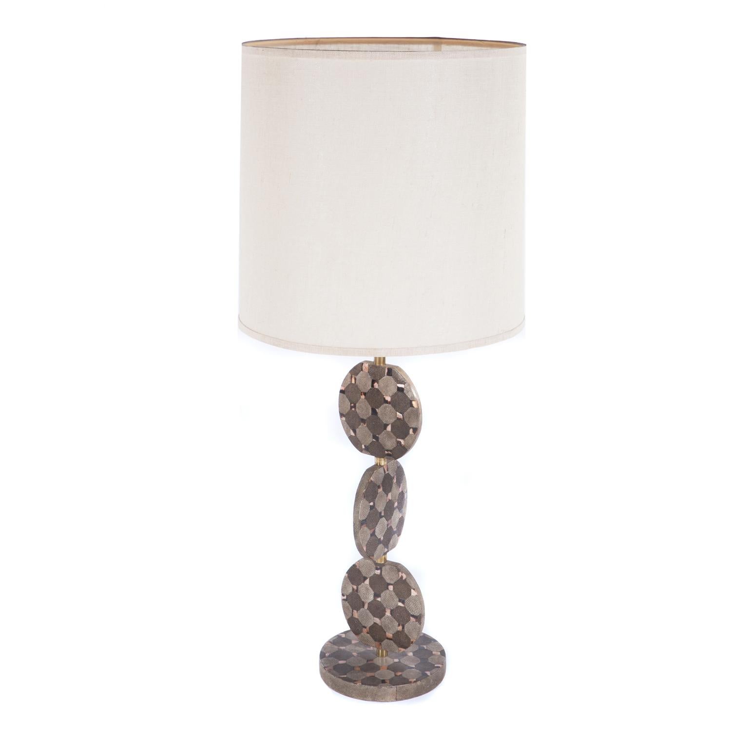 Large sculptural table lamp with stacked disc design in shagreen and horn with brass fittings by R&Y Augousti, France, 1980's.

Measures: Shade diameter 14 inches
Shade height 17.5 inches.