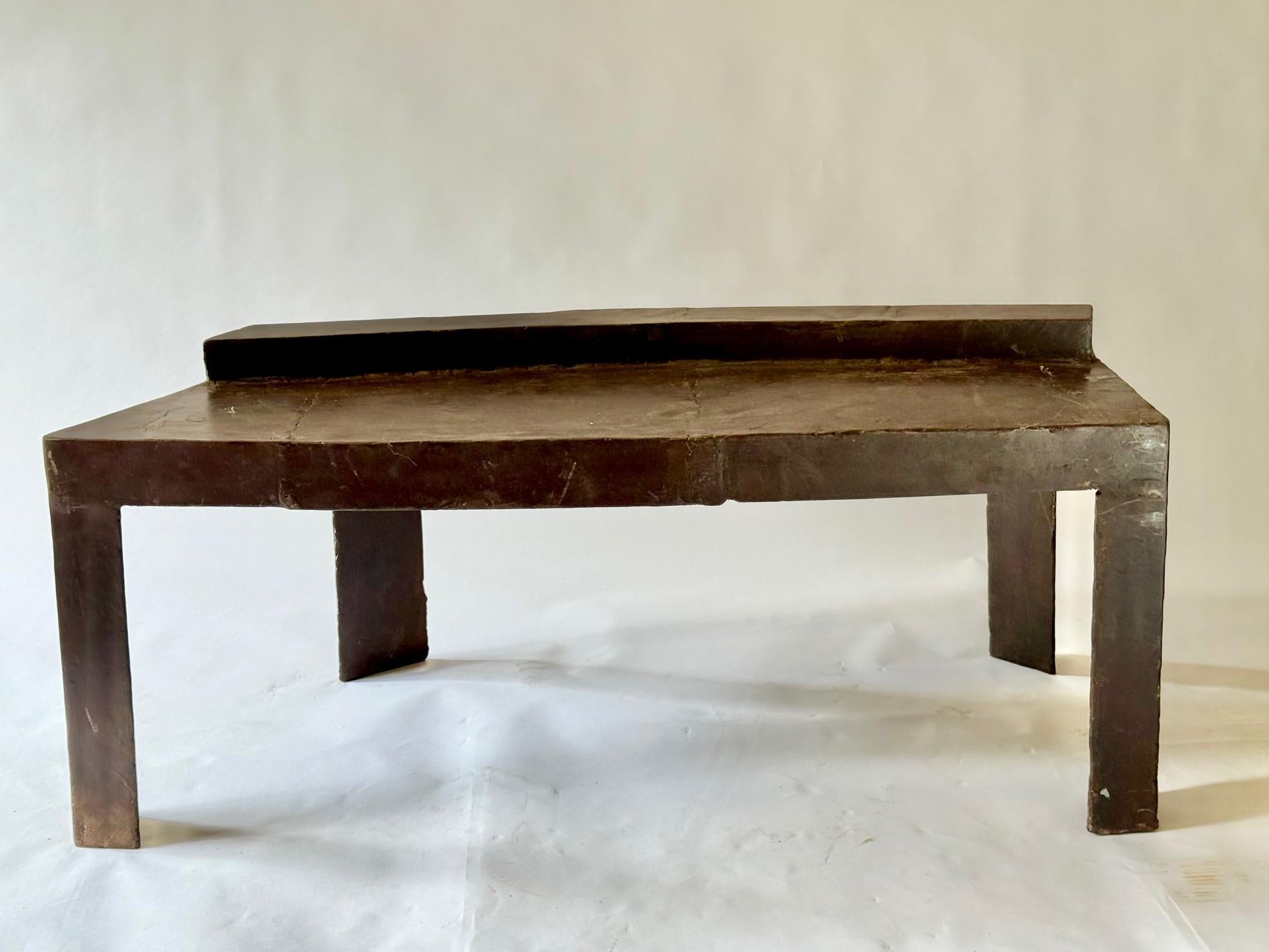 David Hacker is an American Sculptor and Painter.  This Table is Made with Welded pieces of Steel Which Interplay to Give a Textured and hand Fabricated Surface.  The Table is Protected with Heated Beeswax for a Lustrous Velvety Finnish.  It Remains
