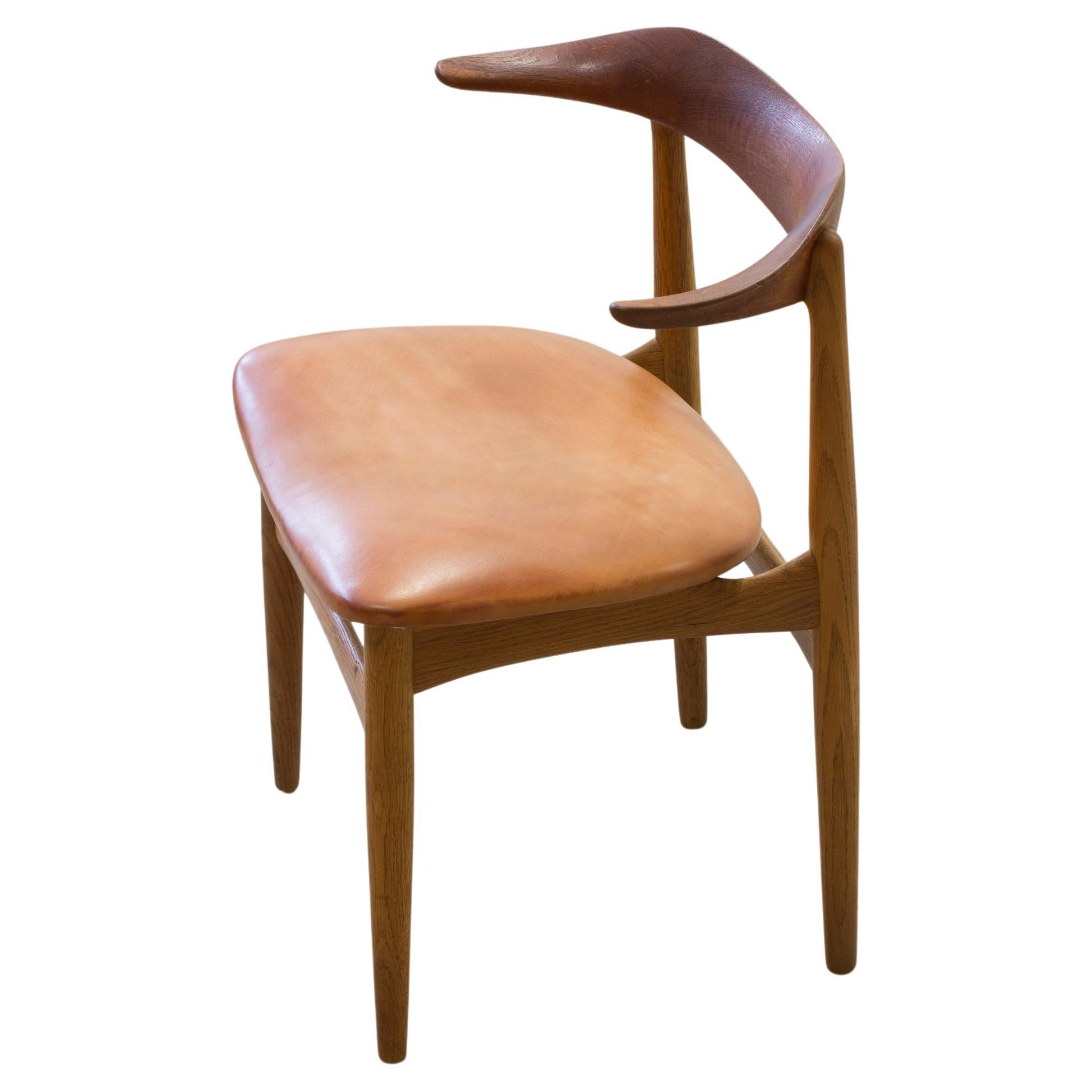 Sculptural teak and oak "Cow horn" chair by Knud Faerch, Denmark, 1950s