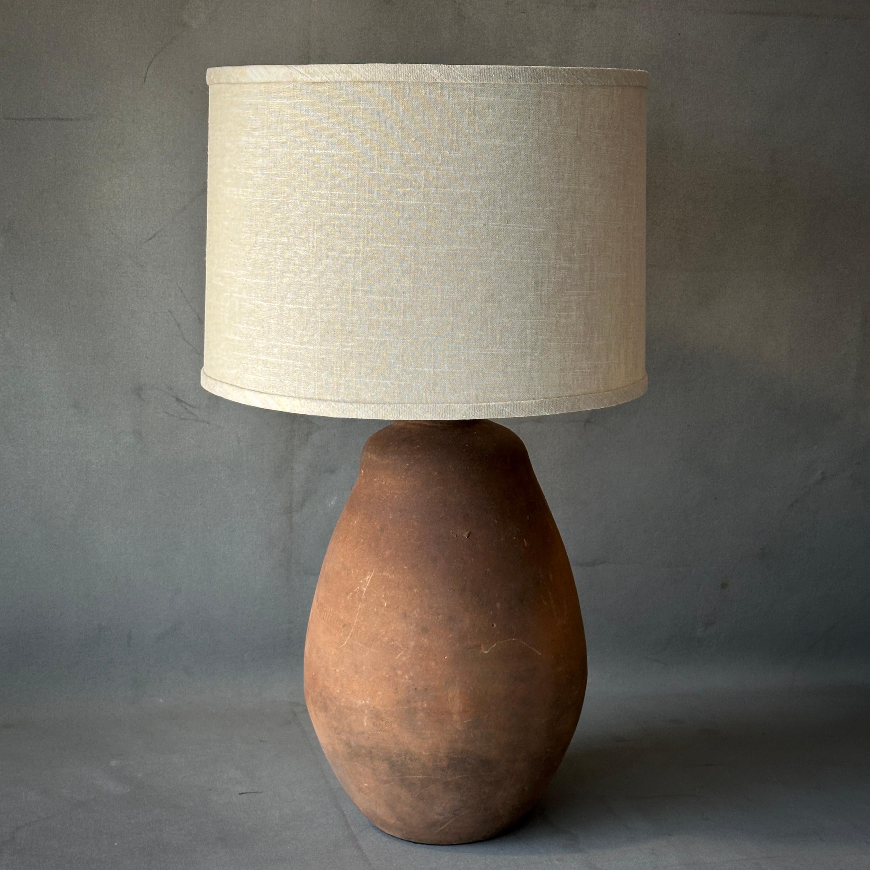 Beatriz is a sensuous, slightly irregular shape terra-cotta vessel as lamp with earthy, handmade appeal.

Discovered at an abandoned potters studio in the Jalisco region of Mexico.

Beatriz
Mexico, 1995