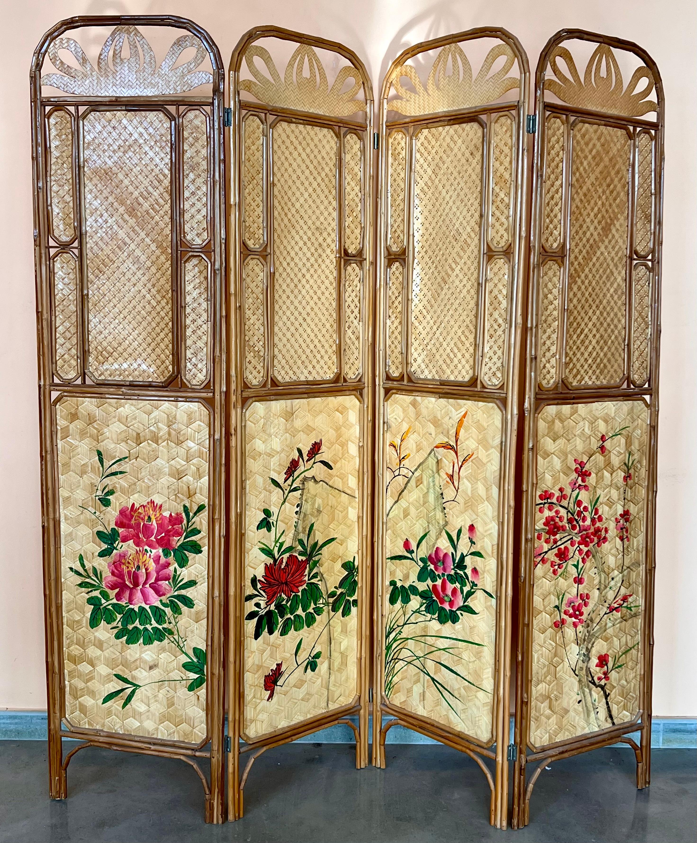 This is a beautiful and rare wooden four-panel folding screen with hand painting en both sides, circa 1960.   Beautiful four-panel screen, room divider, framing with intricately carved geometric design medallions in wood and negative space.  Very