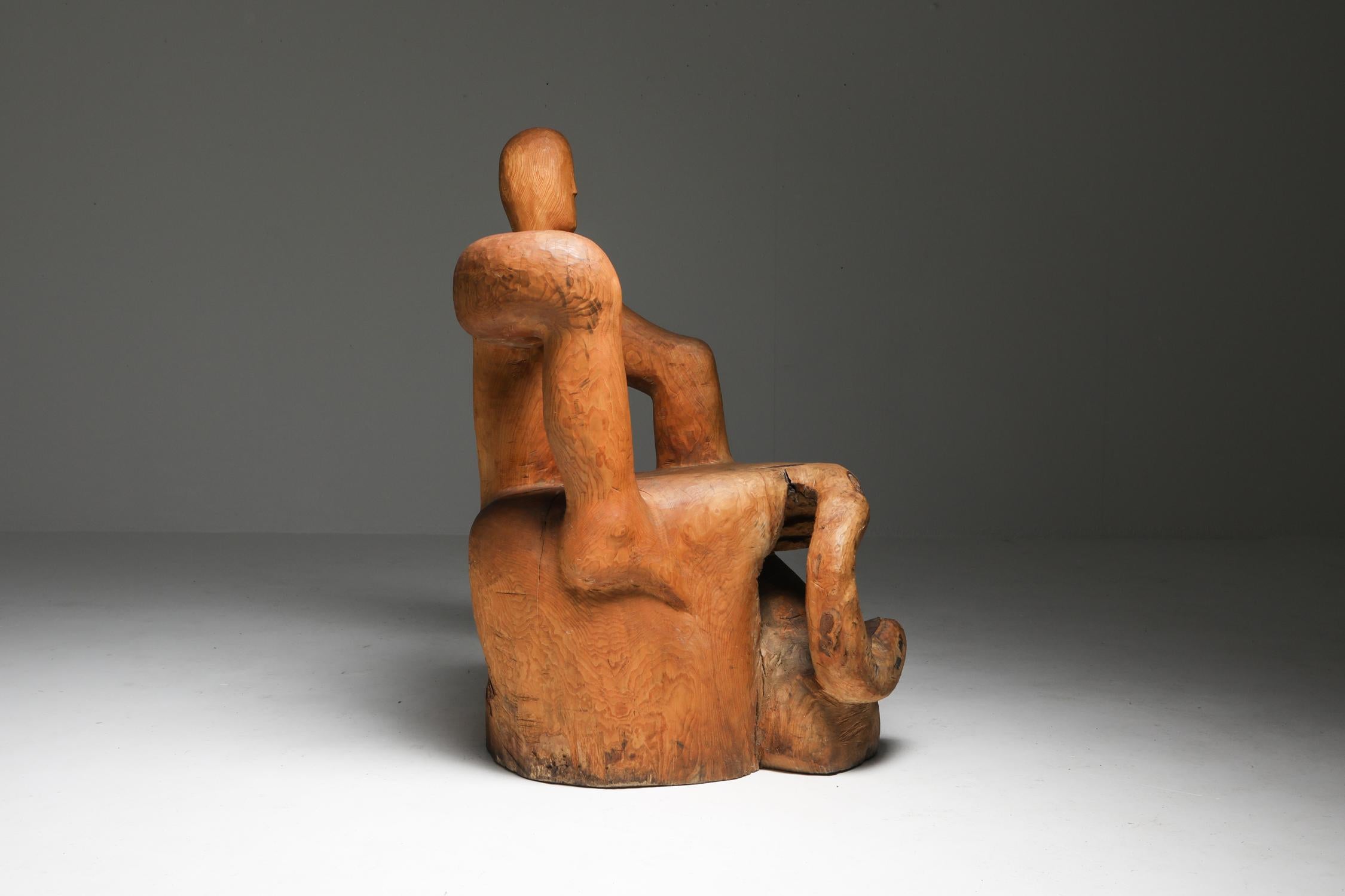 Unusual piece, more a sculpture than a chair, made from one huge log of pine.

Rodin meets Oskar Schlemmer meets Axel Einar Hjorth

Fits as well in a rustic modern wabi sabi decor as in a more eclectic art house.