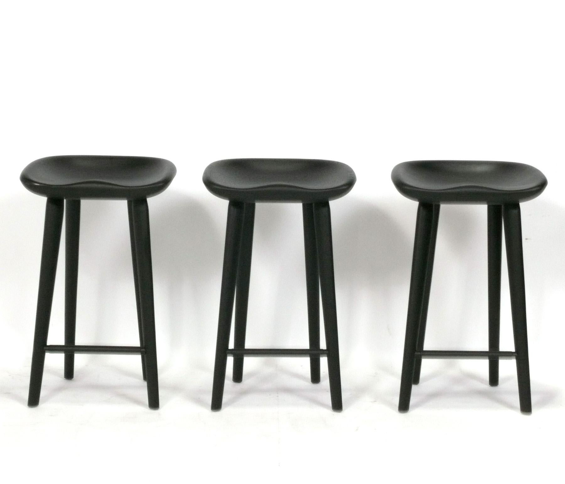 Sculptural Set of Three Tractor Barstools, designed by Craig Bassam for Bassam Fellows, made in Italy, circa 2000s. They retain their original black stained finish and are in very good shape. These are usually priced at $1500 each new. 