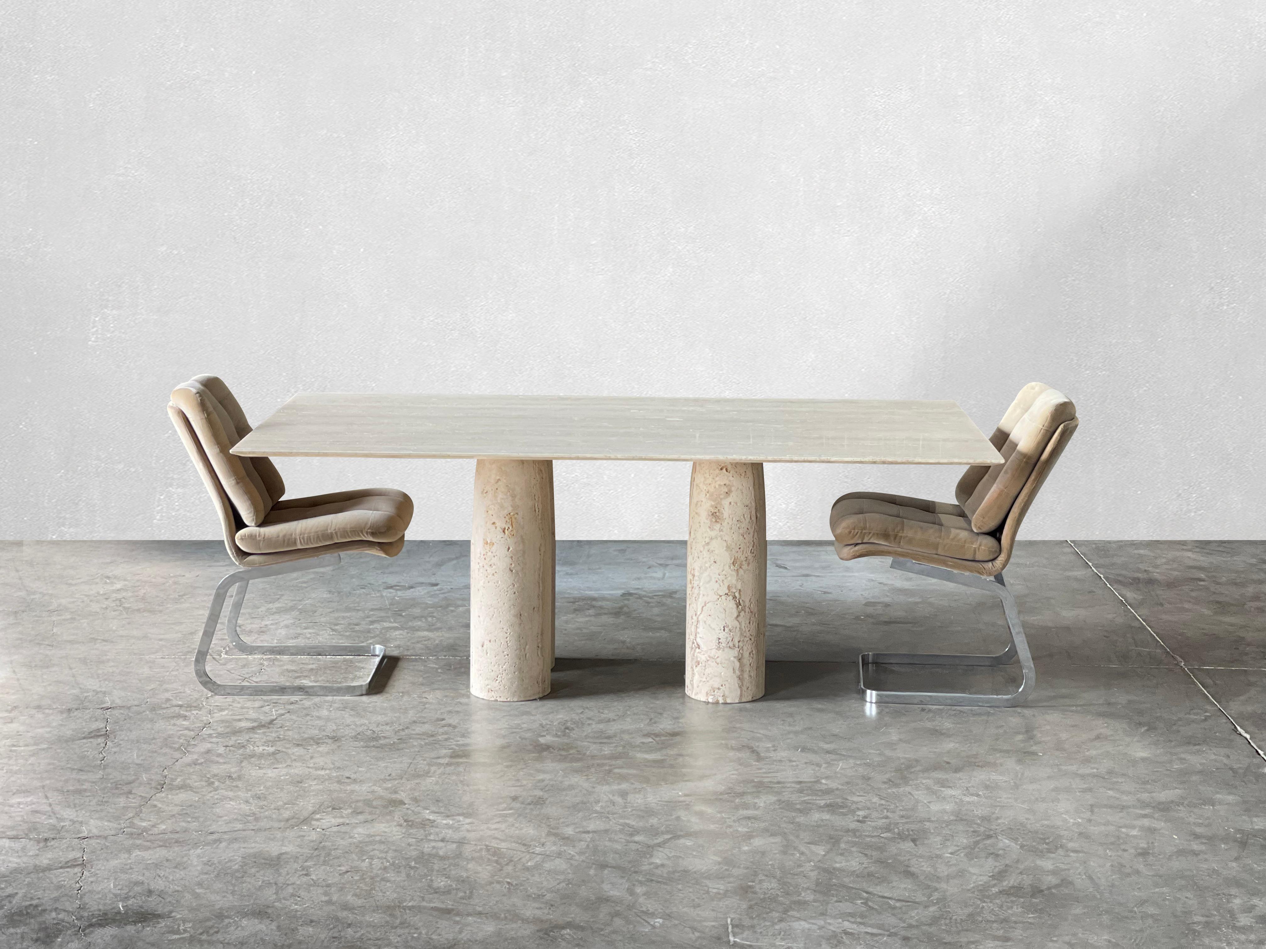 C. 1970

Monumental Italian travertine dining table by Stone International Italy, in the manner of Mario Bellini. This table is styled after Mario Bellini's Il Colonnato dining tables. There are four gorgeous matte unfilled  travertine columns. The