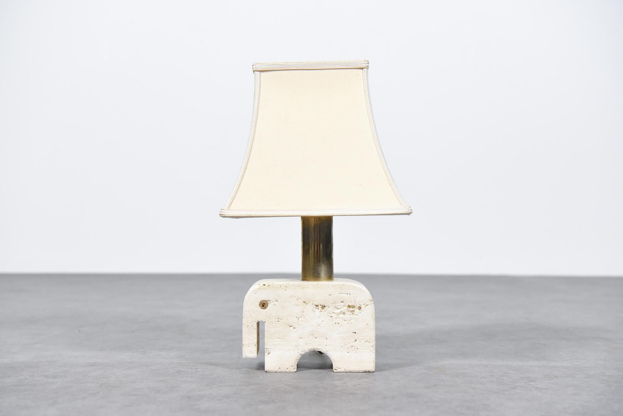 Very rare sculptural travertine table lamp made by the Italian manufacturer Fratelli Manelli in the 1970s. The lamp is in original condition including the lampshade.
