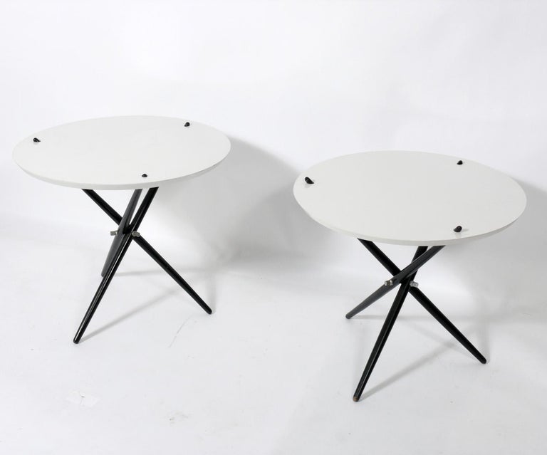 Sculptural tripod tables, designed by Hans Bellman for Knoll, American, circa 1950s. They are a near pair, as the measurements are slightly different. The table on the left measures 21