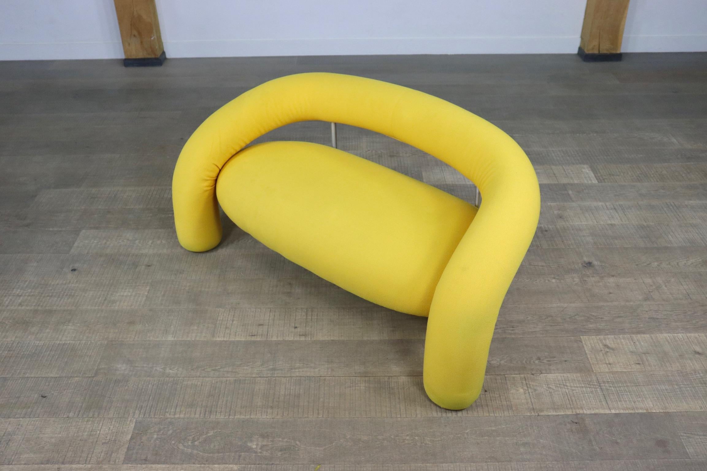Rare sculptural postmodern designer sofa model 'Tube' designed by Anna & Carlo Bartoli for Italian high-end furniture manufacturer Rossi di Albizzate. 
The sofa features internal tubular metal frame, padding in polyurethane foams covered in soft
