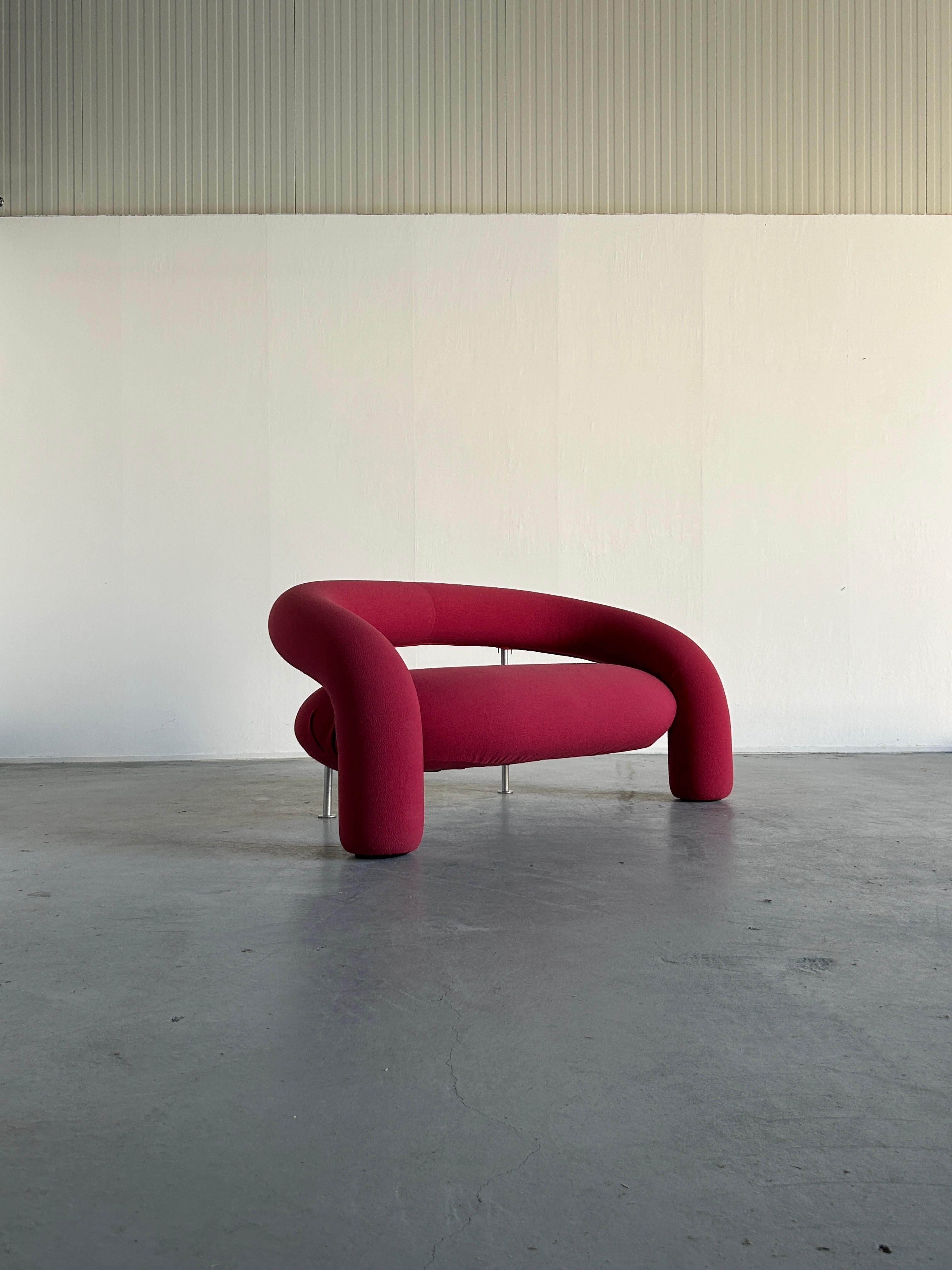 Rare sculptural postmodern designer sofa model ''Tube'' designed by Anna & Carlo Bartoli for Italian high-end furniture manufacturer Rossi di Albizzate.

The sofa features internal tubular metal frame, padding in polyurethane foams covered in soft