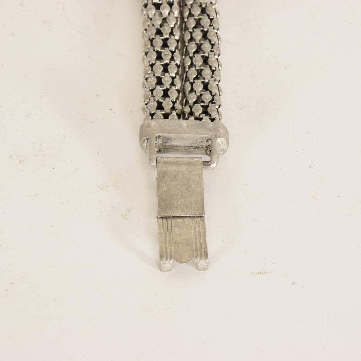 Art Deco period sculptural aluminum twisted french cable bracelet, 1940s.
Fabulous sculptural modernist design center knot double row wide band
In the style of contemporary designer David Yurman cable classic and aluminum designs.
Unmarked, no