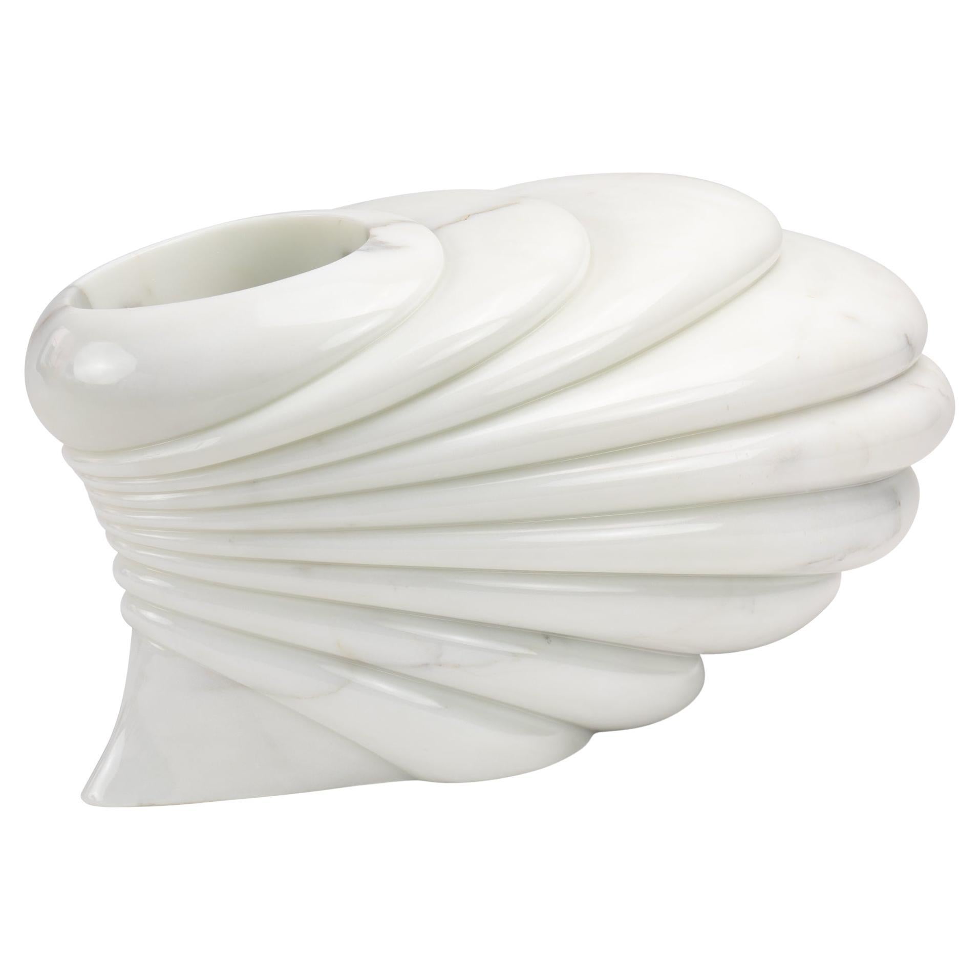 “Dunes” is a sculptural vase entirely hand-carved from a single block of Statuario marble. Each piece begins with a careful selection of the block, chosen for its natural tones and veining, with the collector-client actively involved in selecting