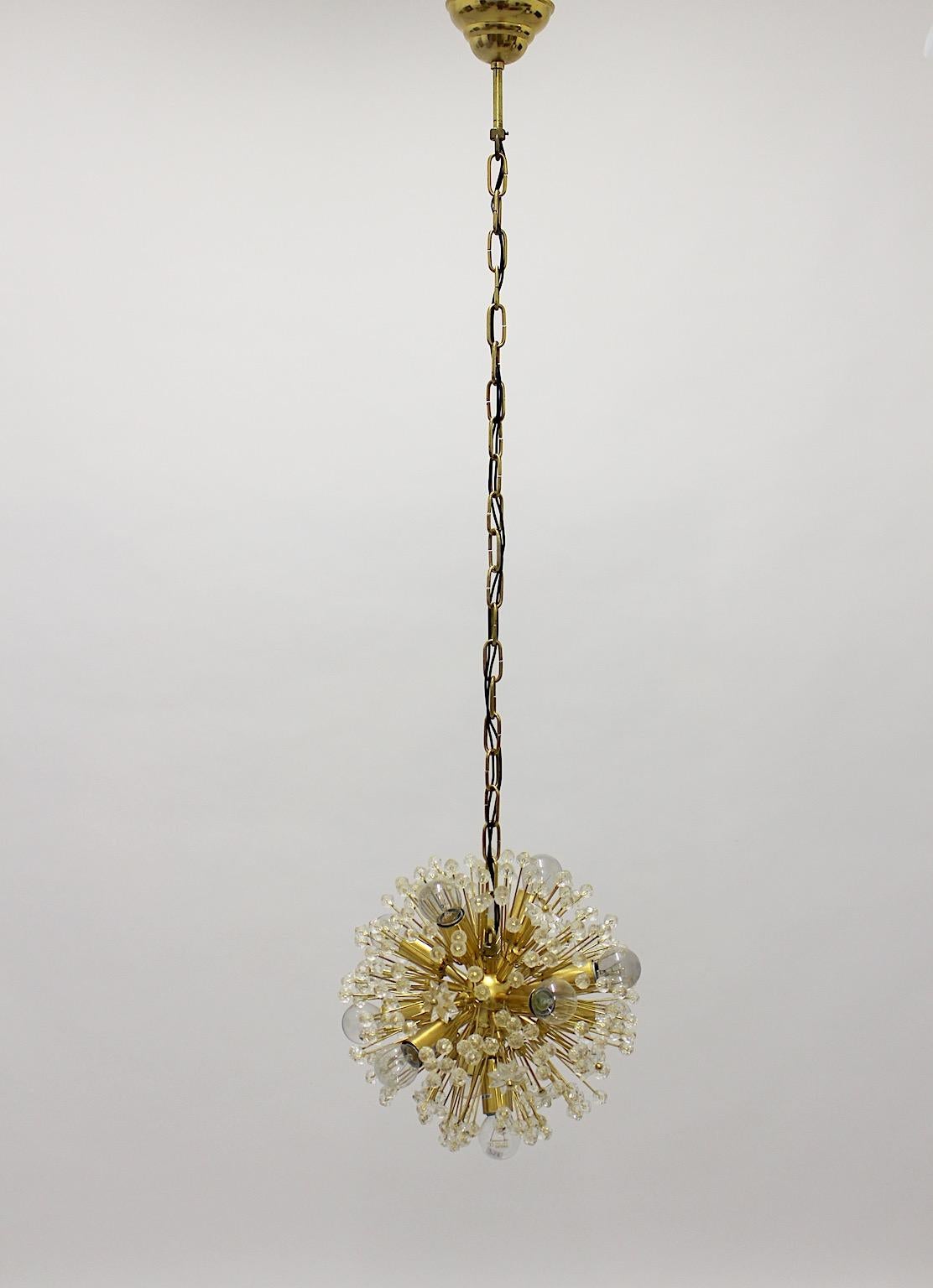 Organic vintage chandelier or hanging lamp in dandelion form from brass gold plate and lucite attributed to Emil Stejnar 1955 Vienna and manufactured 1960s.
An amazing vintage pendant showing a gold plated brass body with lucite stars and