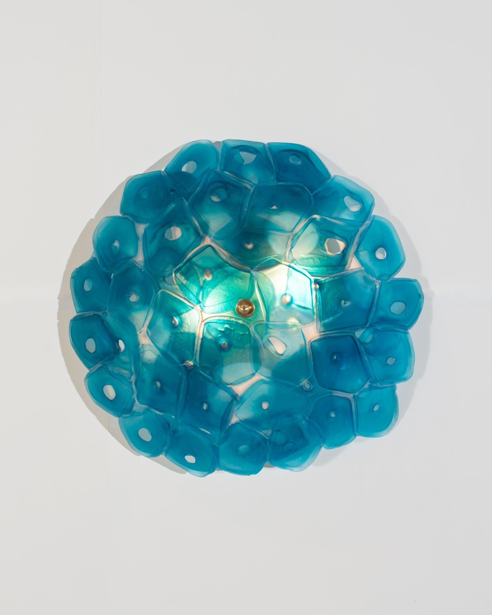 Unique wall-mounted sconce illuminated sculpture in slumped and fused blue glass. Designed and made by Jeff Zimmerman, USA, 2018.
   