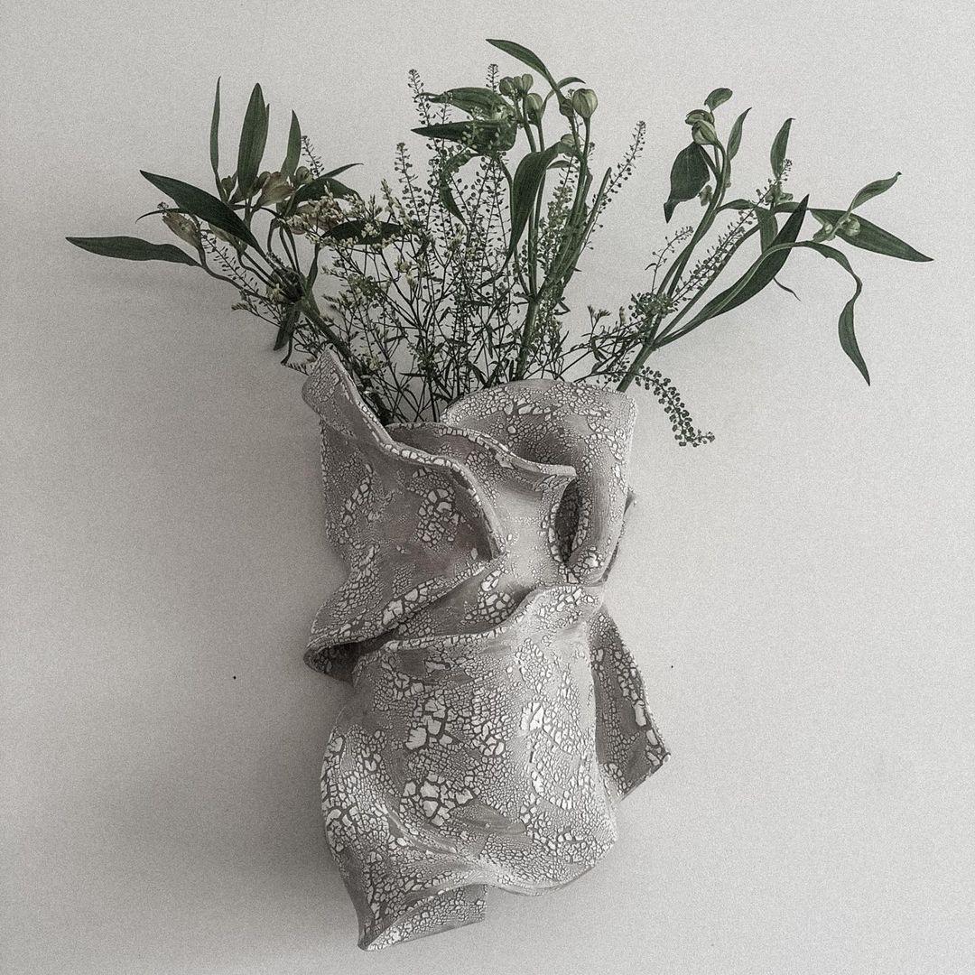 Sculptural Wall Vase II by Alexandra Madirazza
Dimensions: W 40 x D 25 x H 45 cm (These are approximate measurements)
Materials: Stoneware
Also available in brown, white or gray glaze. Matt or glossy.

Alexandra is an architect, but for the past 5