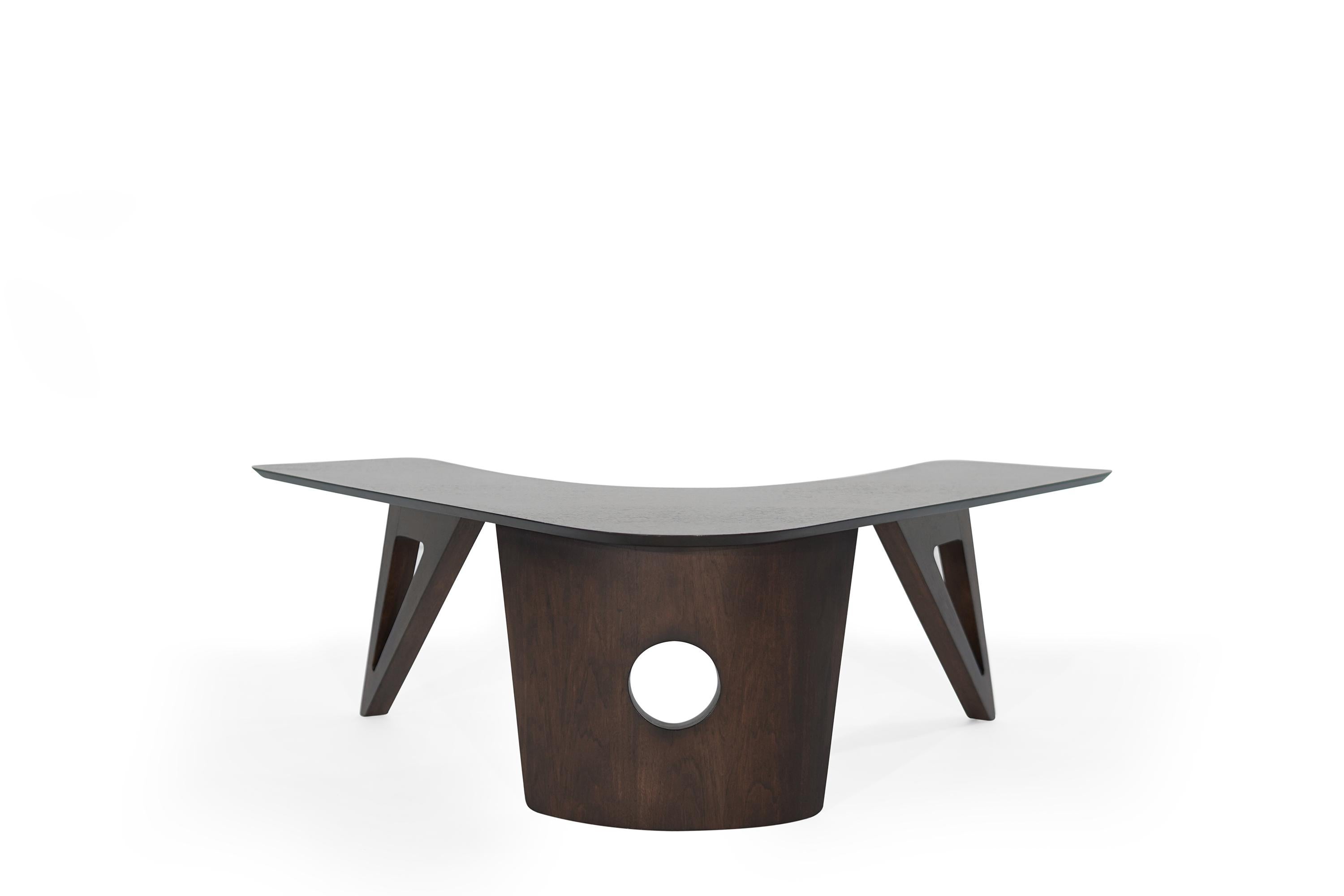 Walnut coffee table featuring a boomerang-shaped top, fully restored to its original espresso finish.
