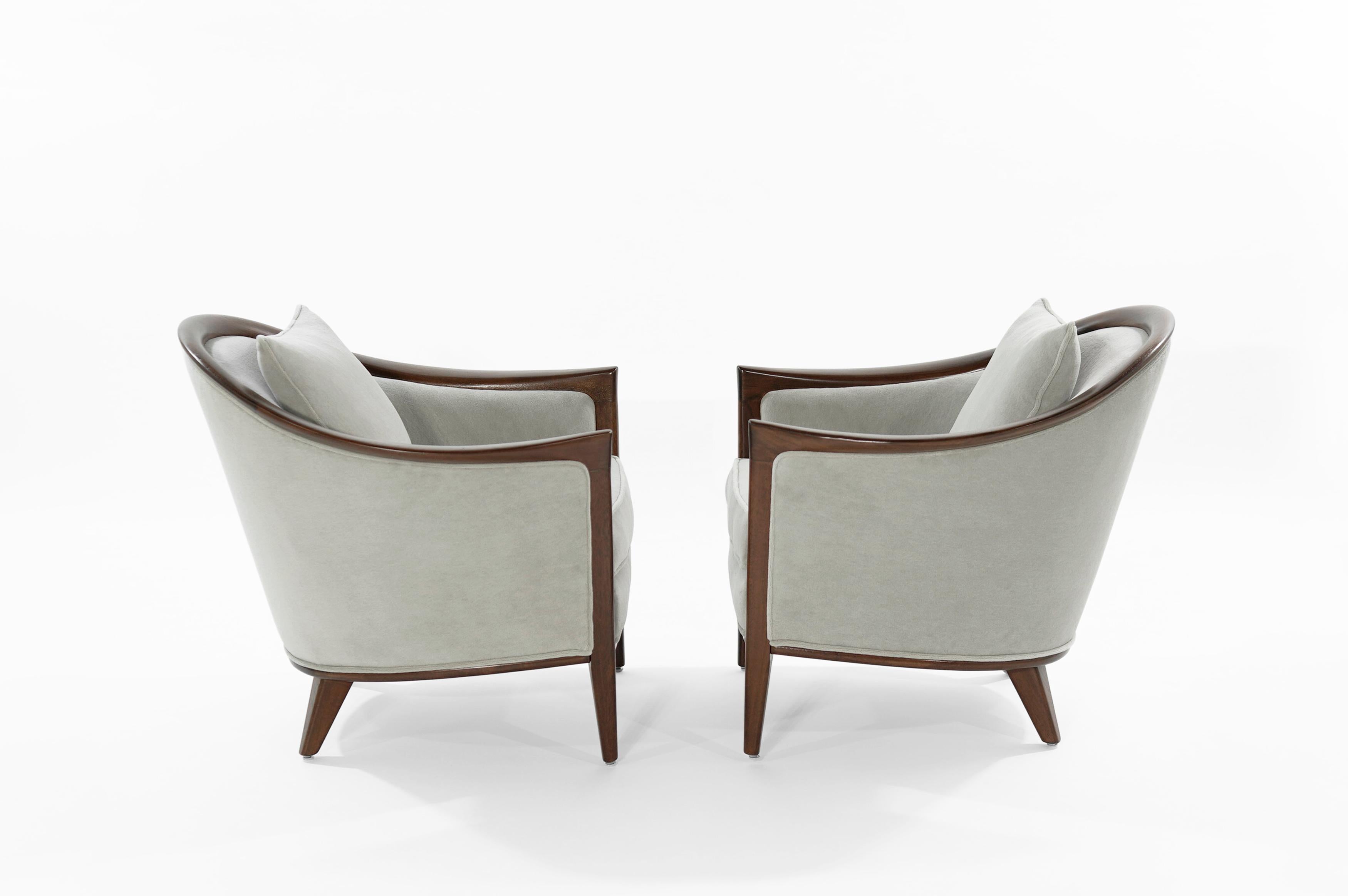 Pair of fully restored lounge chairs featuring sculptural walnut framing and lumbar support.
Newly upholstered in grey alpaca velvet by Holly Hunt.