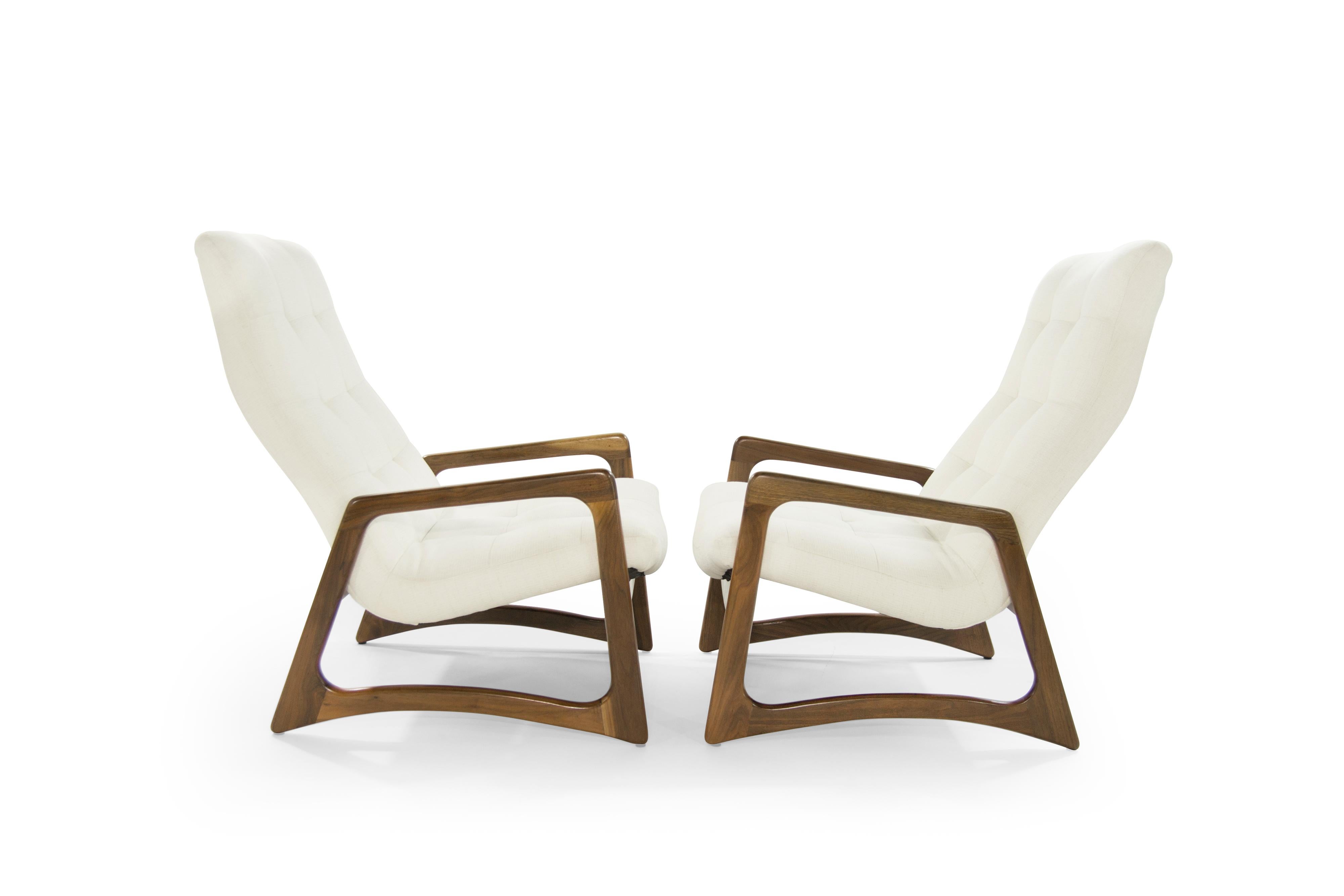 Pair of lounge chairs designed by Adrian Pearsall, circa 1950s. Sculptural walnut framing fully restored, newly upholstered in off-white twill by Holly Hunt.