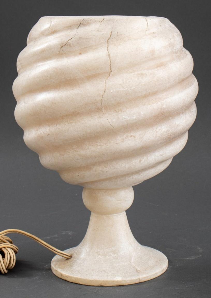 Sculptural white plaster uplight, of round, spiral grooved form on a turned socle and round base. Measures : 11