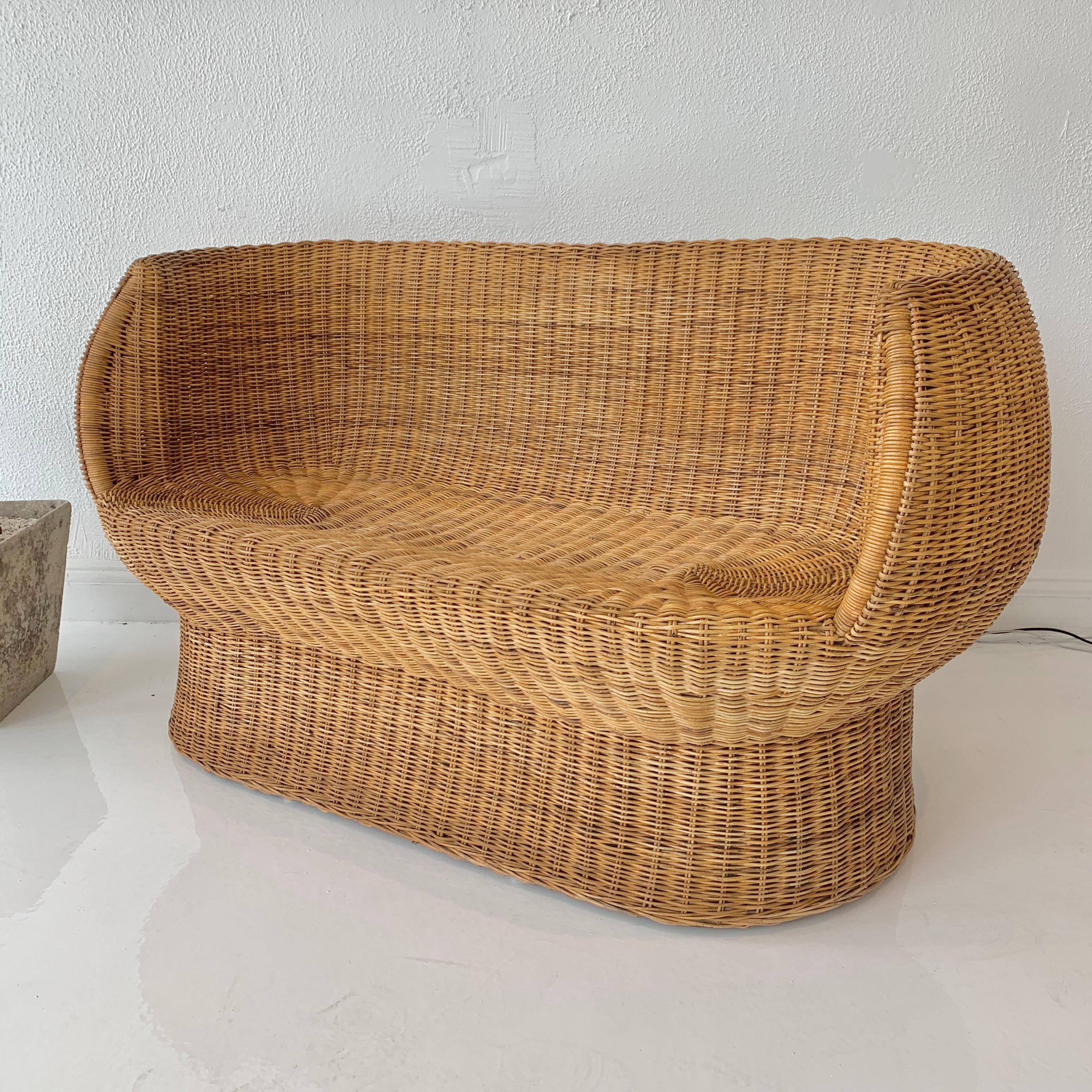 Gorgeous woven wicker settee by Isamu Kenmochi. Perfect scale, and very good condition. Rare, early piece of his work. 
 