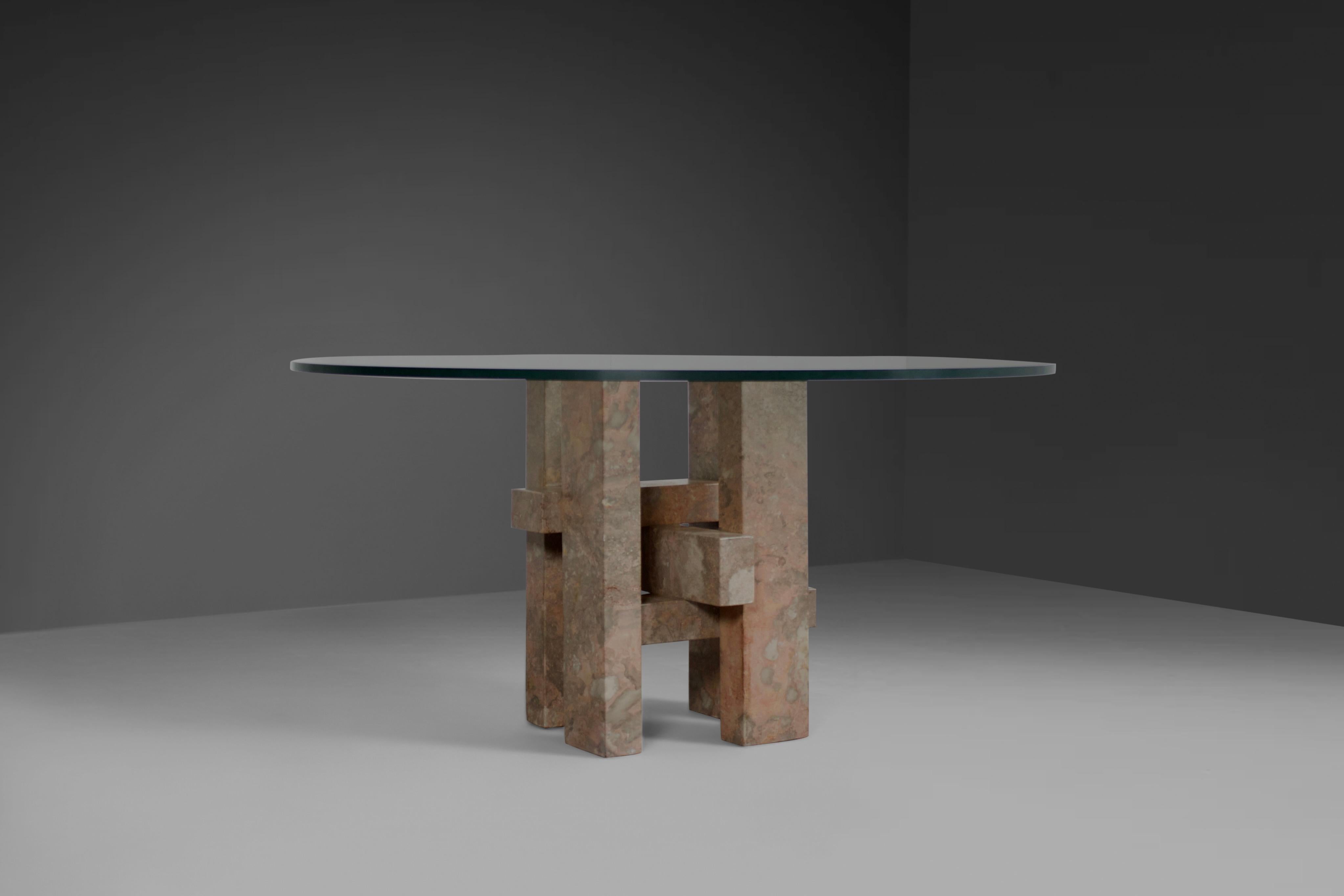 Impressive dining table by Studio Willy Ballez in very good condition. 

Designed in Belgium in the 1970s.

This sculptural table is a perfect example of postmodern design. 

The handmade abstract base is made from thick solid marble beams which are