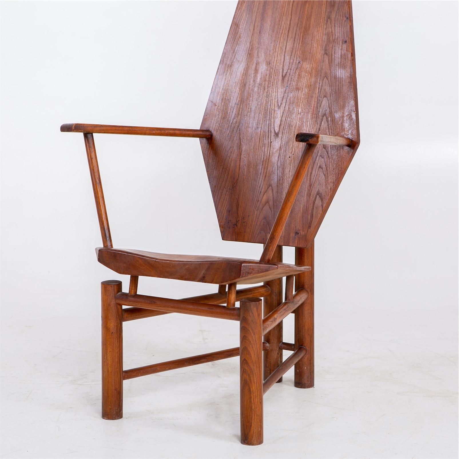 Large wooden armchair of exceptional sculptural design with hexagonal backrest and base constructed of cylindrical wooden struts.