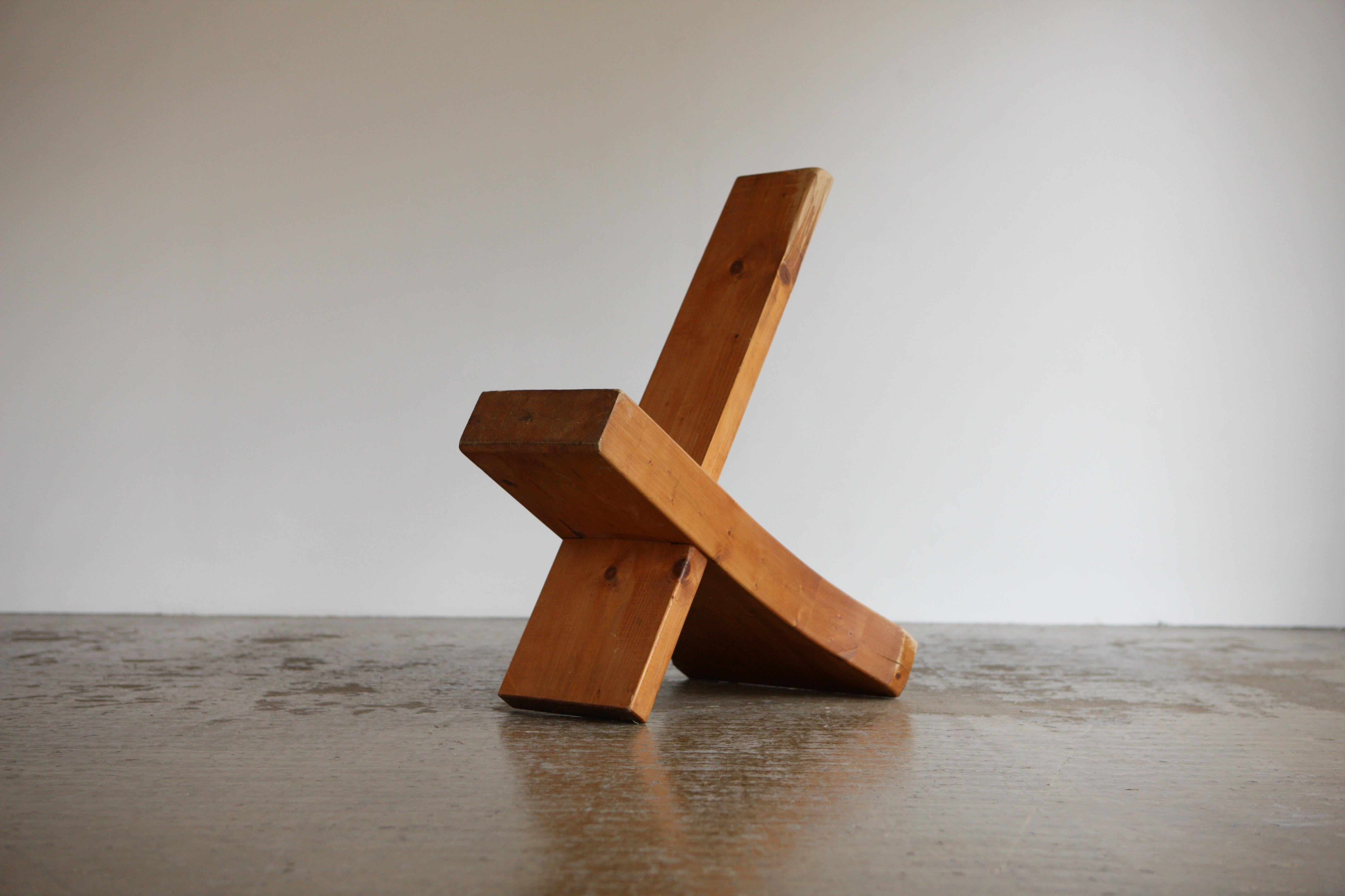 A modernist chair in solid beech comprising of two interlocking pieces that slot into each other to create a statement side chair.