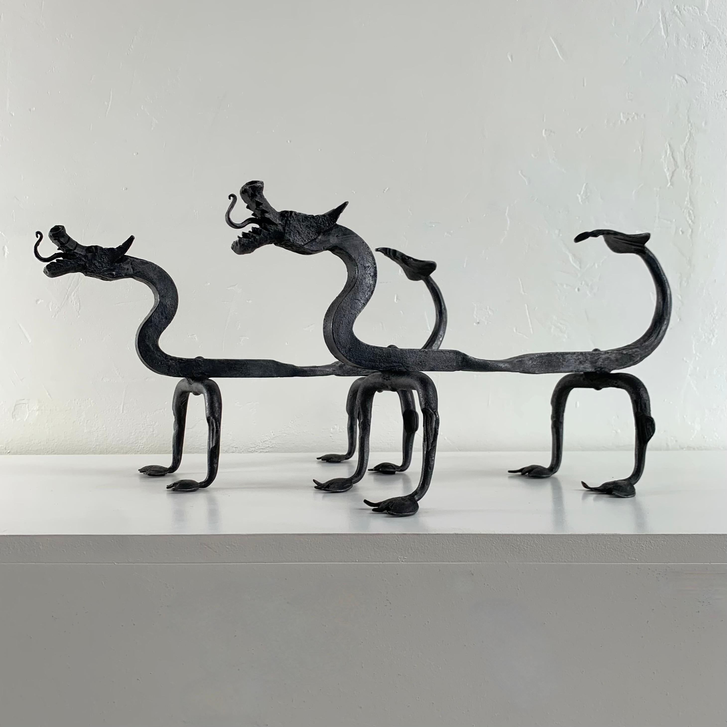 Mid-Century Modern Sculptural Wrought Iron Pair Of Dragons Andirons, circa 1910, United States. For Sale