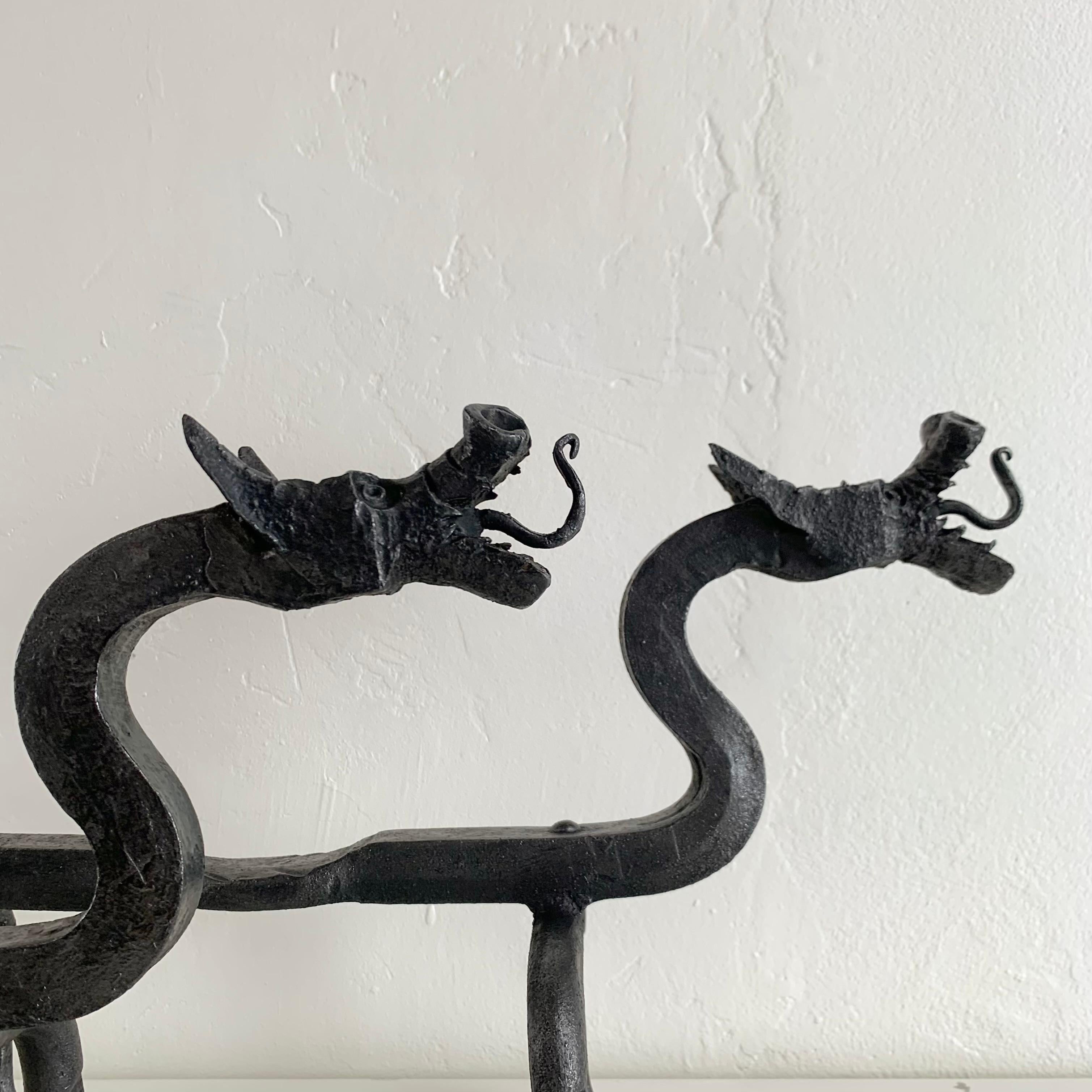 American Sculptural Wrought Iron Pair Of Dragons Andirons, circa 1910, United States. For Sale