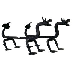 Sculptural Wrought Iron Pair Of Dragons Andirons, circa 1910, United States.
