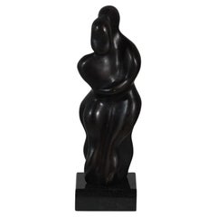 Sculpture abstraite "Le Couple". Bronze plein sur socle granit noir.  Signé DK"