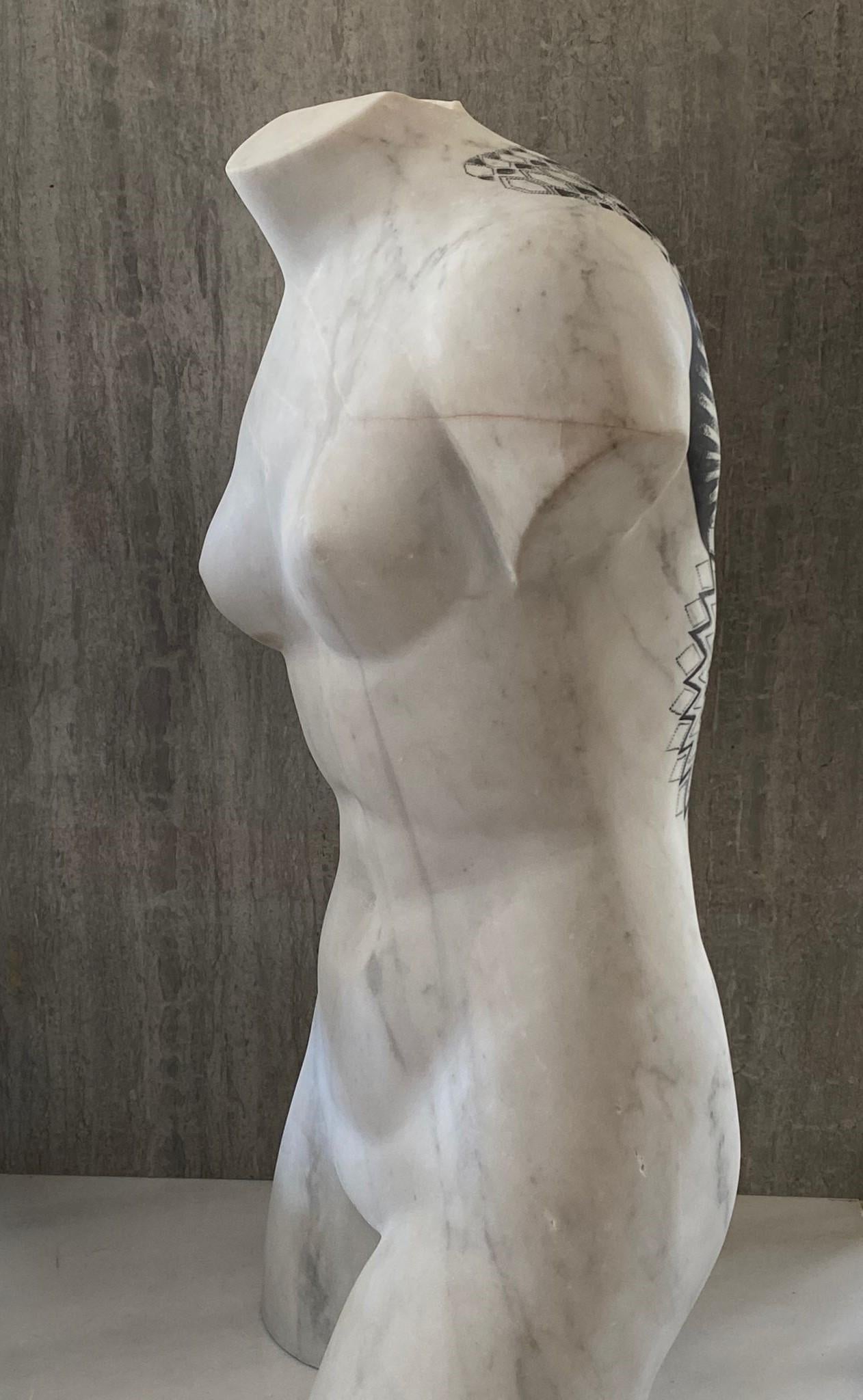 The sculpture bust was made from a single block of Statuario Carrara marble.
Tattoo was made with manual micro-dots technique by the artist.
  