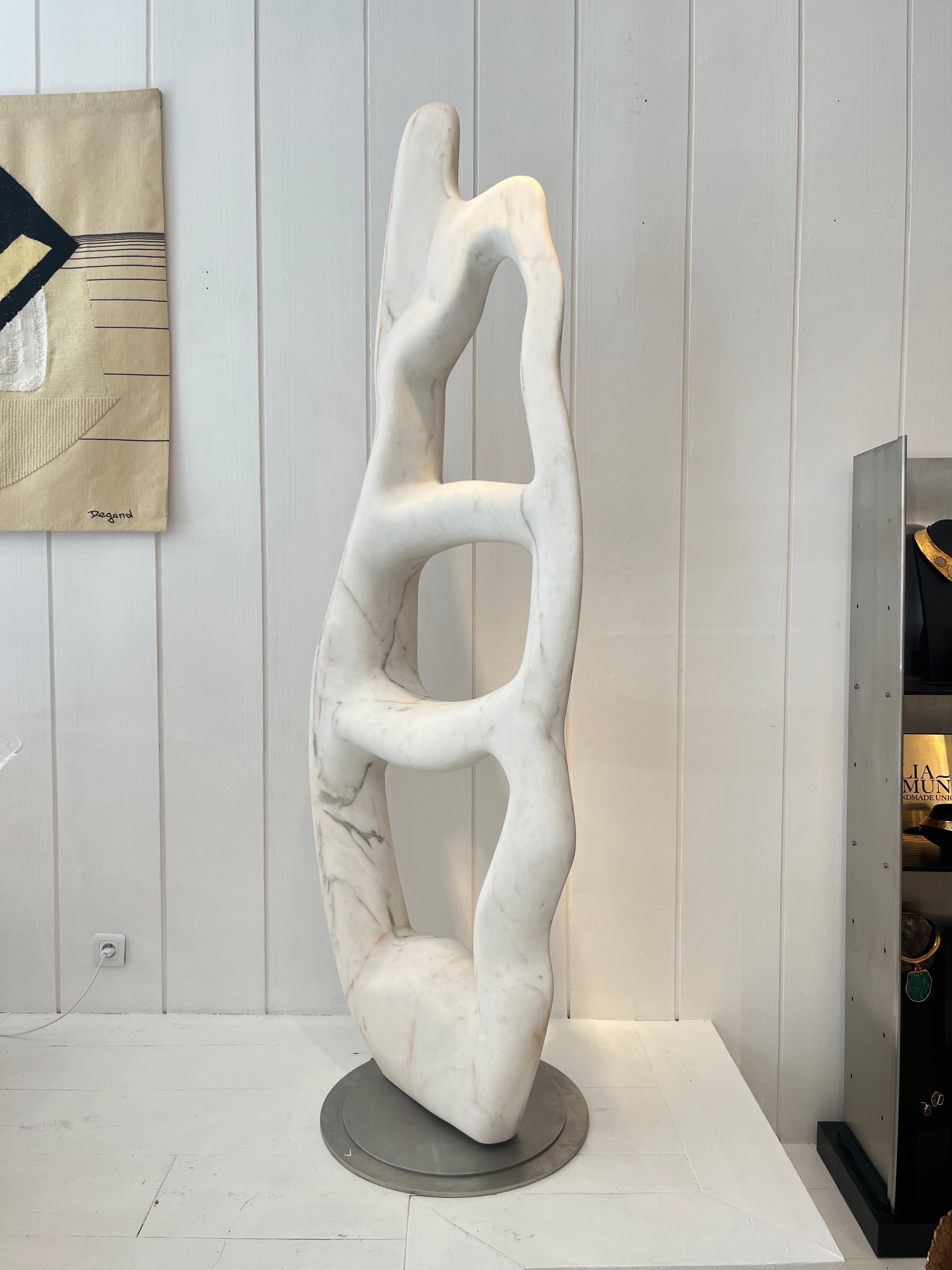 Jean-Frédéric Bourdier, monumental white marble sculpture 
the sculpture rotates 360 degres on the stazinlees steel base
Estremoz marble
Perfect  to  be places outside.
Signed by the artist
Width: 82 cm Height: 220 cm Diameter: 57 cm.