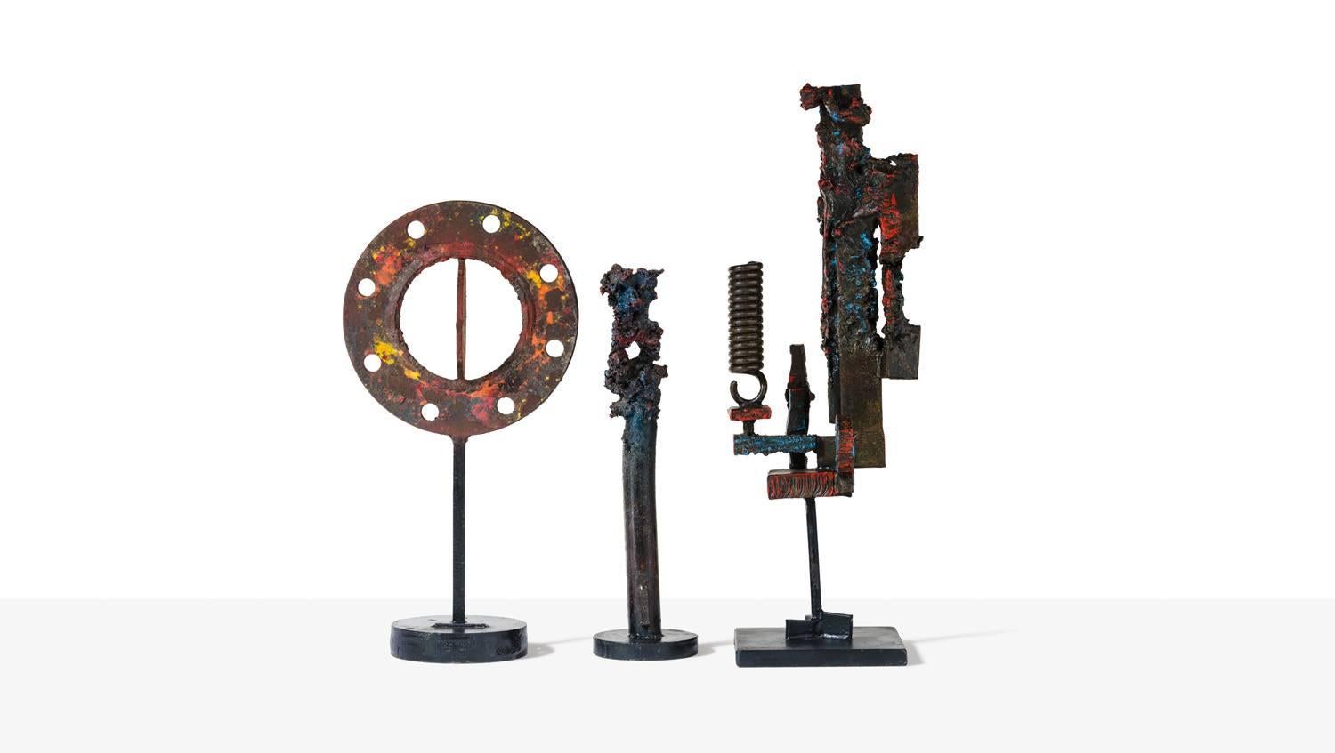 'Arcobaleno' sculpture by Salvino Marsura.
Steel with powder colored pigments baked onto the surface. 

Arcobaleno is shown in the photos with two other sculptures.
Price shown is for Arcobaleno only, but all three pieces can be bought as a set
