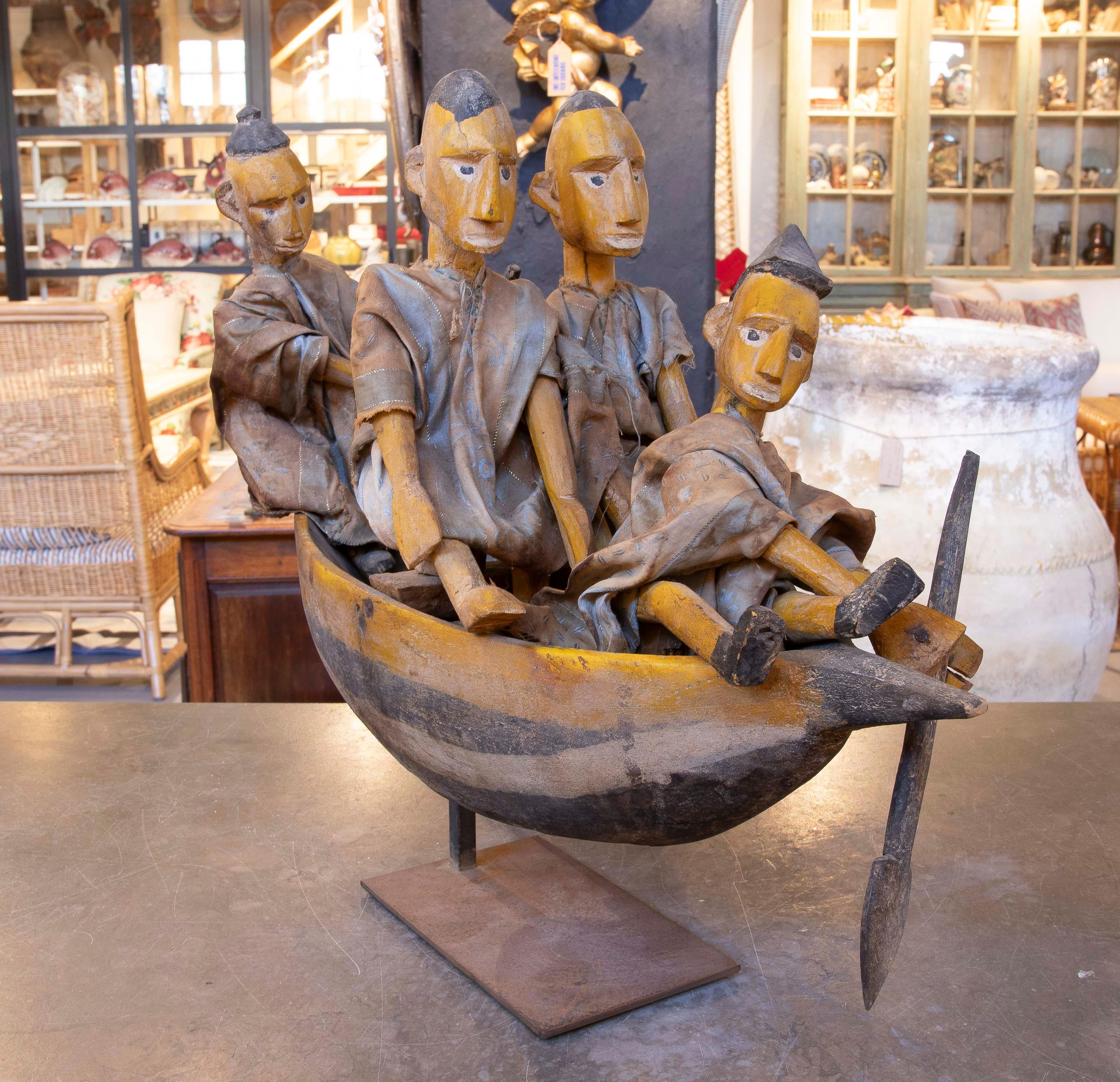 European Sculpture Carved in Wood of Characters in a Boat with Cloth Costumes For Sale