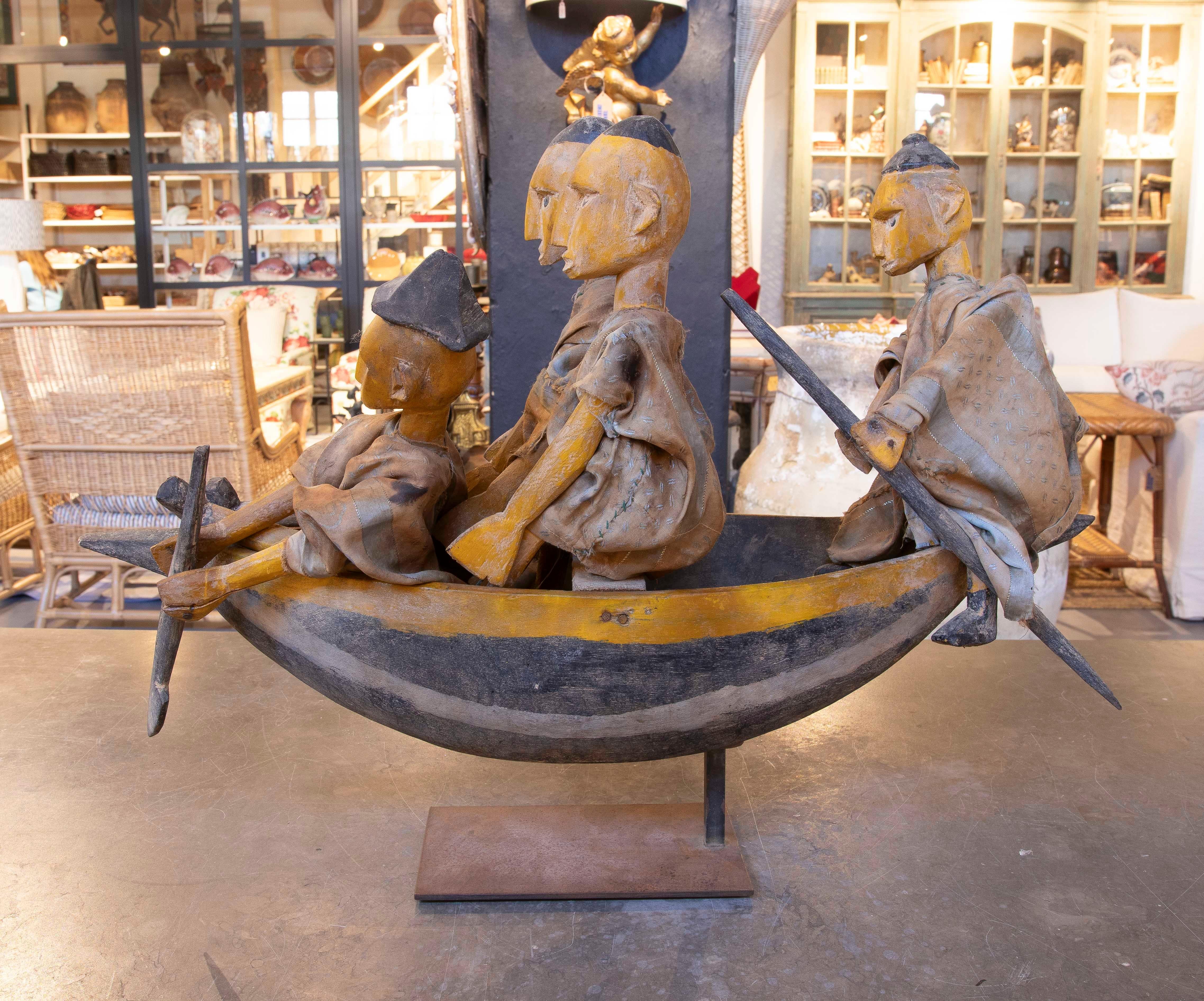 20th Century Sculpture Carved in Wood of Characters in a Boat with Cloth Costumes For Sale